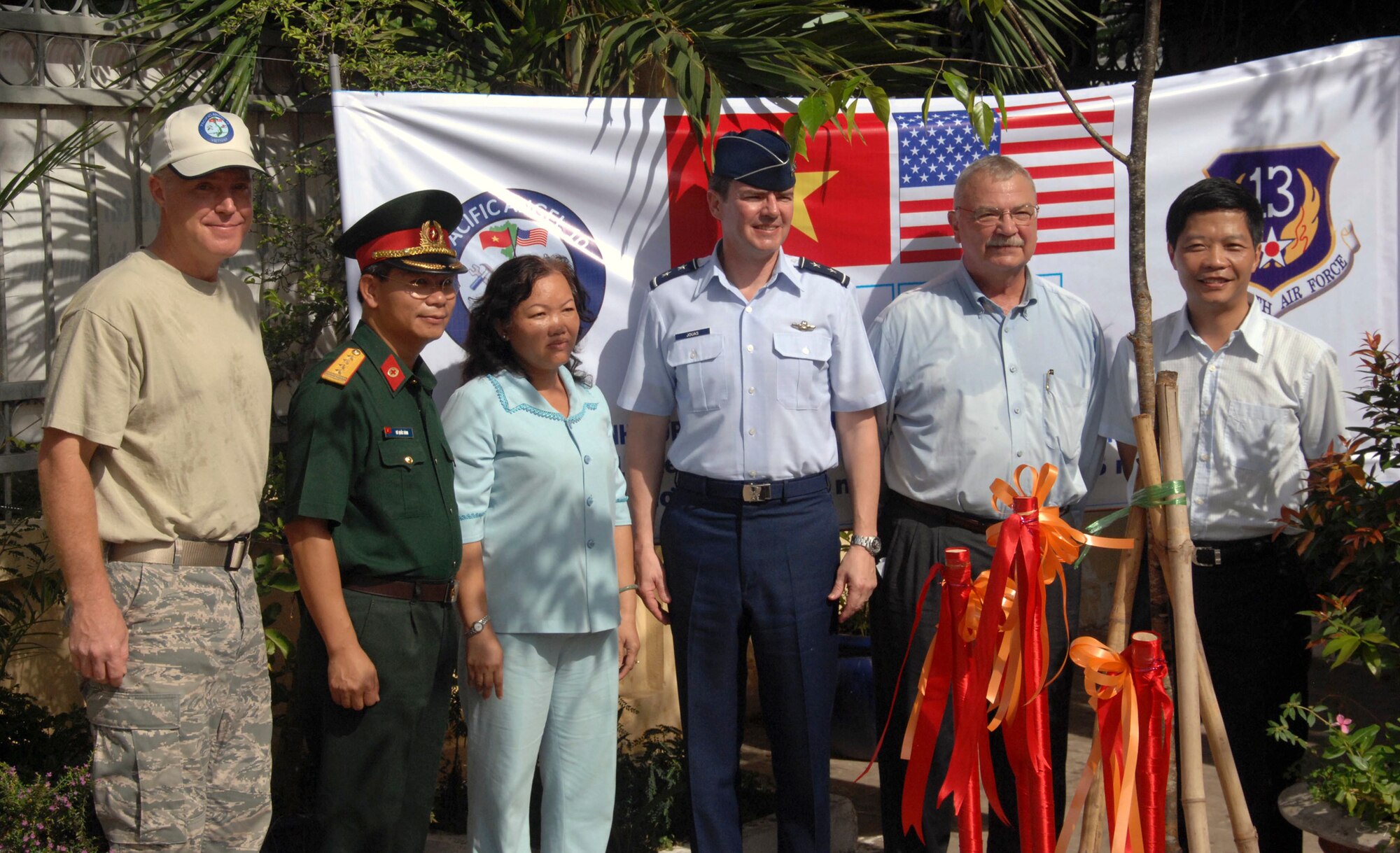 Lt. Col Blair English (left), Vietnamese Col. Van Tham , Maj. Gen. Jan-Marc Jouas and other senior Vietnam and U.S. leaders conclude the Pacific Angel 2010 mission in during a ceremony May 17, 2010, in Vietnam. Colonel English is the U.S. mission commander for Pacific Angel 2010, Colonel Tham is from Vietnam Military Region 9 and General Jouas is the U.S. Pacific Air Forces director of Operations, Plans, Requirements and Programs. (U.S. Air Force photo/Capt. Timothy Lundberg) 