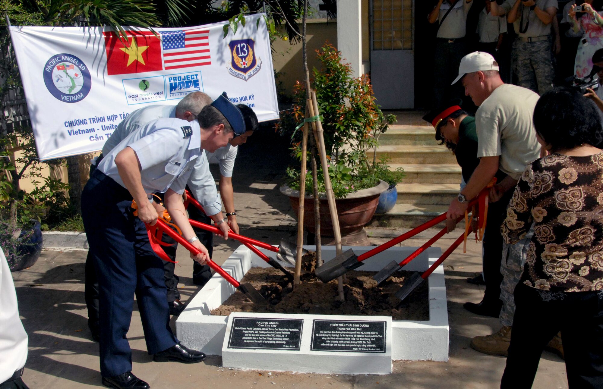 Maj. Gen. Jan-Marc Jouas (left), Lt. Col. Blair English and other senior members from the United States and Vietnam, plant a tree at the village elementary school, where humanitarian medical care was provided as part of Pacific Angel 2010 May 17, 2010, in Vietnam. General Jouas is the U.S. Pacific Air Forces director of Operations, Plans, Requirements and Programs and Colonel English is the mission commander for Pacific Angel 2010. (U.S. Air Force photo/Capt. Timothy Lundberg)