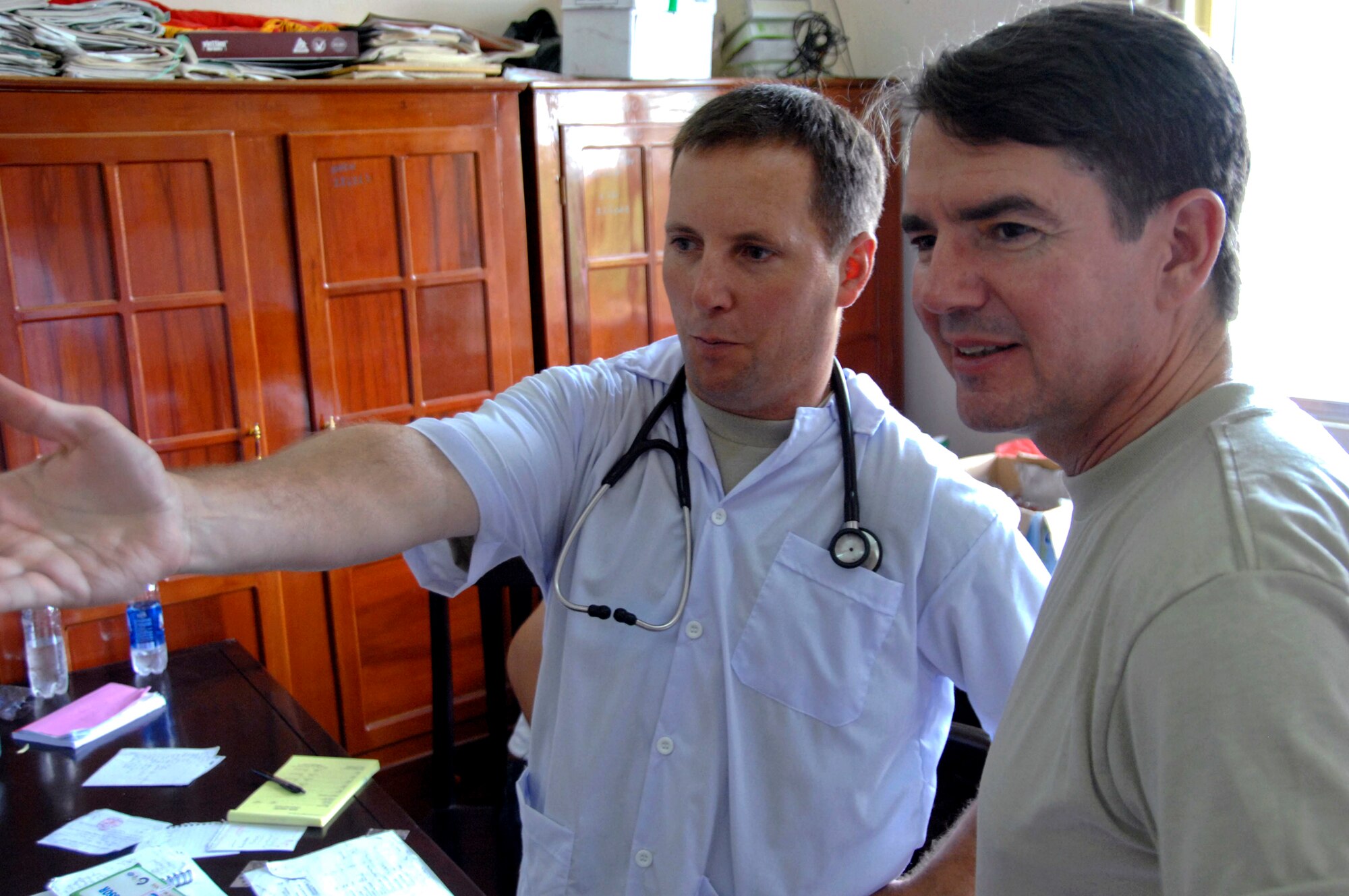 Lt. Col. Gerald Delk (left) briefs Maj. Gen. Jan-Marc Jouas on the bi-national family practice clinic in Tan Thoi, Vietnam, during Pacific Angel 2010 on May 15, 2010. General Jouas is the U.S. Pacific Air Forces director of Operations, Plans, Requirements and Programs. (U.S. Air Force photo/Capt. Timothy Lundberg)