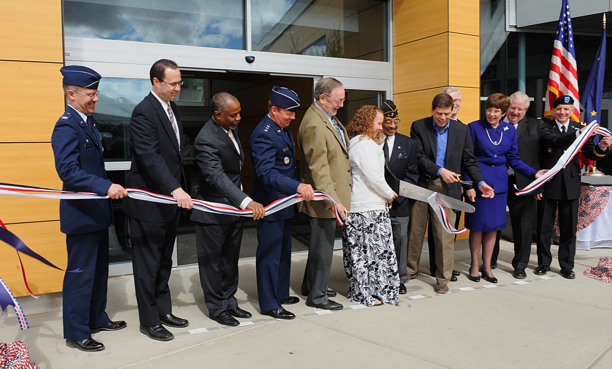 ANCHORAGE, Alaska -- Civic leaders, Veterans Affairs personnel and military leaders gathered for the ribbon cutting ceremony of the Anchorage VA Outpatient Clinic and Anchorage Regional Office May 15. The new VA facility will offer expanded services, such as rehabilitation services, ophthalmology, increased primary care, mental health access and home-based primary care service. (Air Force photo by Senior Airman Cynthia Spalding)
