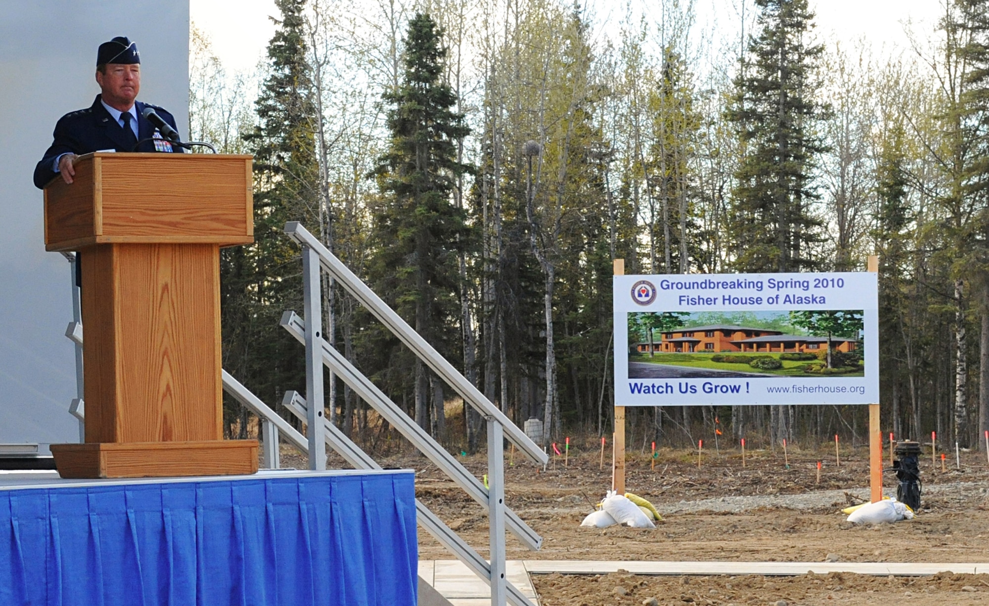 ELMENDORF AIR FORCE BASE, Alaska -- Lt. Gen. Dana T. Atkins speaks at the Fisher House of Alaska groundbreaking ceremony May 15. The Fisher House is supported by and linked to a non-profit community service organization. All eligible Department of Defense and veteran beneficiaries and their families are eligible to use the Fisher House. General Atkins is the Alaskan Command commander. (Air Force photo by Senior Airman Cynthia Spalding)