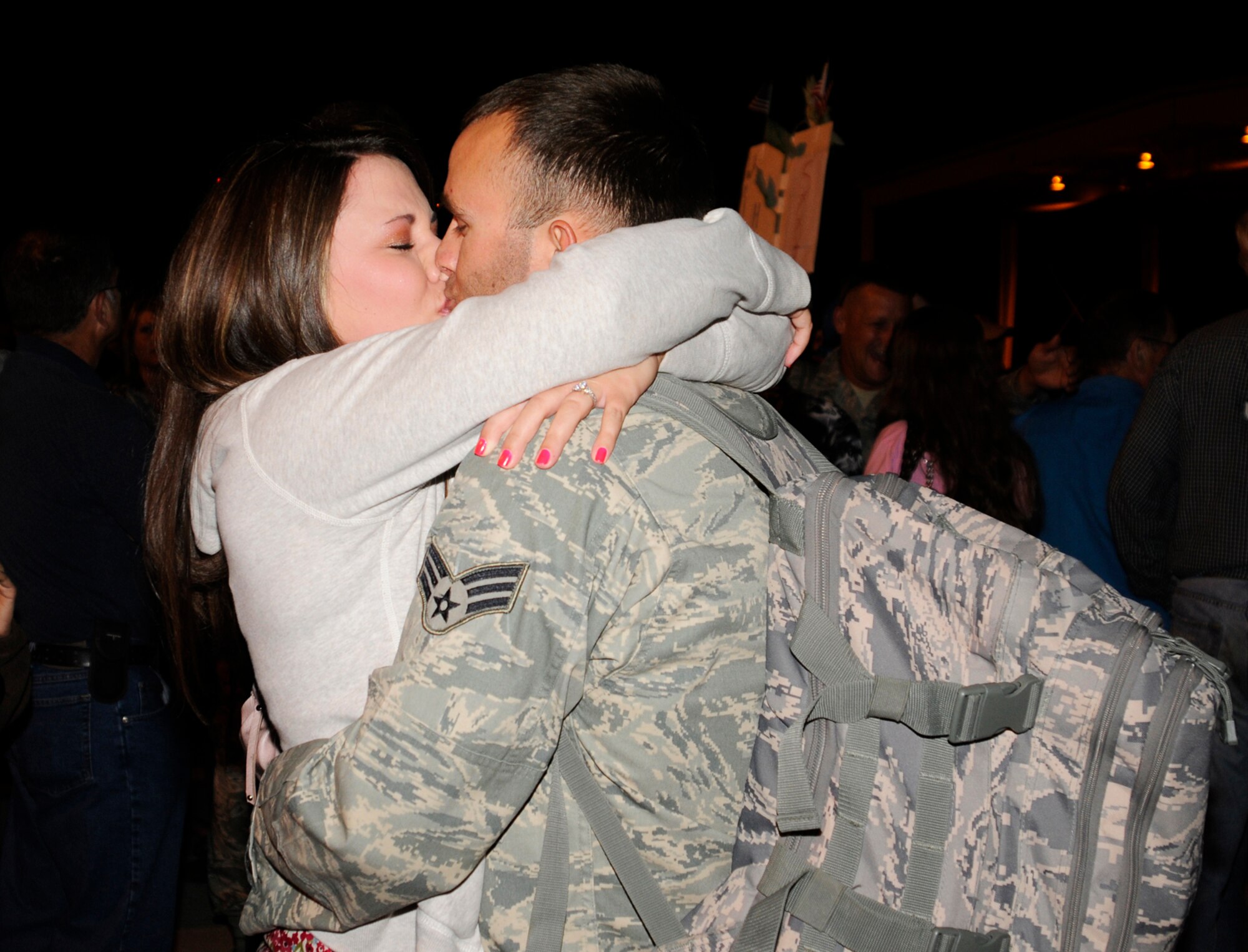 A member of the 188th Fighter Wing is reunited with his wife during a late-night homecoming assembly at the 188th Fighter Wing in Fort Smith, Ark. More than 200 members of the 188th arrived just before midnight, May 17 at the Air National Guard unit. More than 1,000 people attended the homecoming gathering, which celebrated the return of the 188th from a deployment to Kandahar Airfield in Afghanistan. (U.S. Air Force photo by Capt. Heath Allen/Arkansas National Guard Public Affairs)