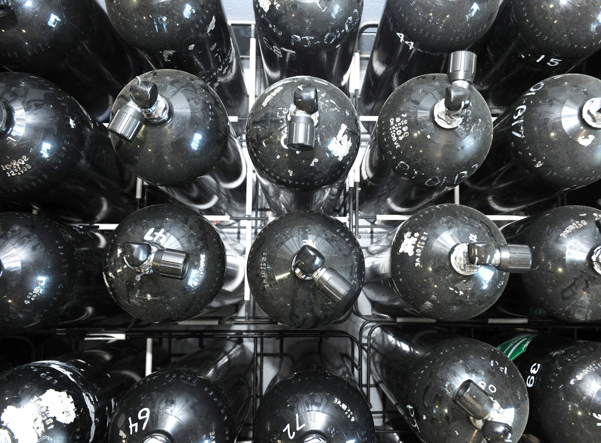 Scuba tanks are lined up for use at the 38th Rescue Squadron logistics flight maritime operations section May 12, 2010, at Moody Air Force Base, Ga. The scuba tanks are used for inflating portable watercraft and also for open-ocean search and rescue missions when scuba diving is necessary. (U.S. Air Force photo/Airman 1st Class Benjamin Wiseman)