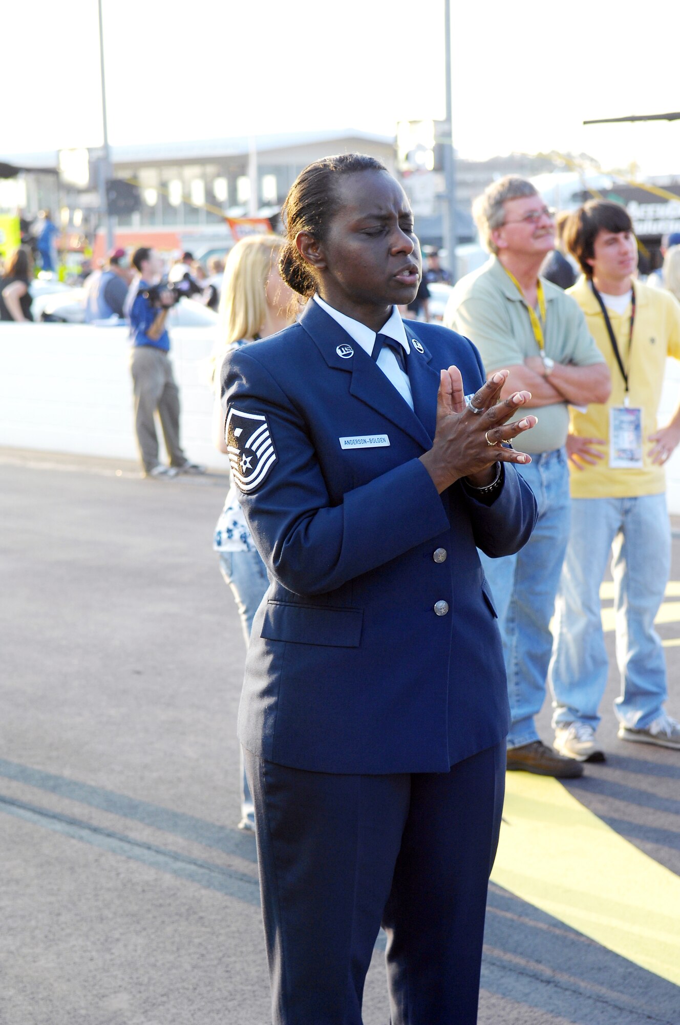 Master Sgt. Tressie Anderson-Bolden, 14th Air Support Operations Squadron First Sergeant, gets in some last minute practicing before singing the National Anthem at a Nationwide series Royal Purple 200 NASCAR race at Darlington Raceway in Darlington S.C. on May 7. Sergeant Anderson-Bolden was one of three Pope Airmen selected to sing the National Anthem during the races held May 7 and 8. (U.S. Air Force photo/Senior Airman Kris Levasseur)