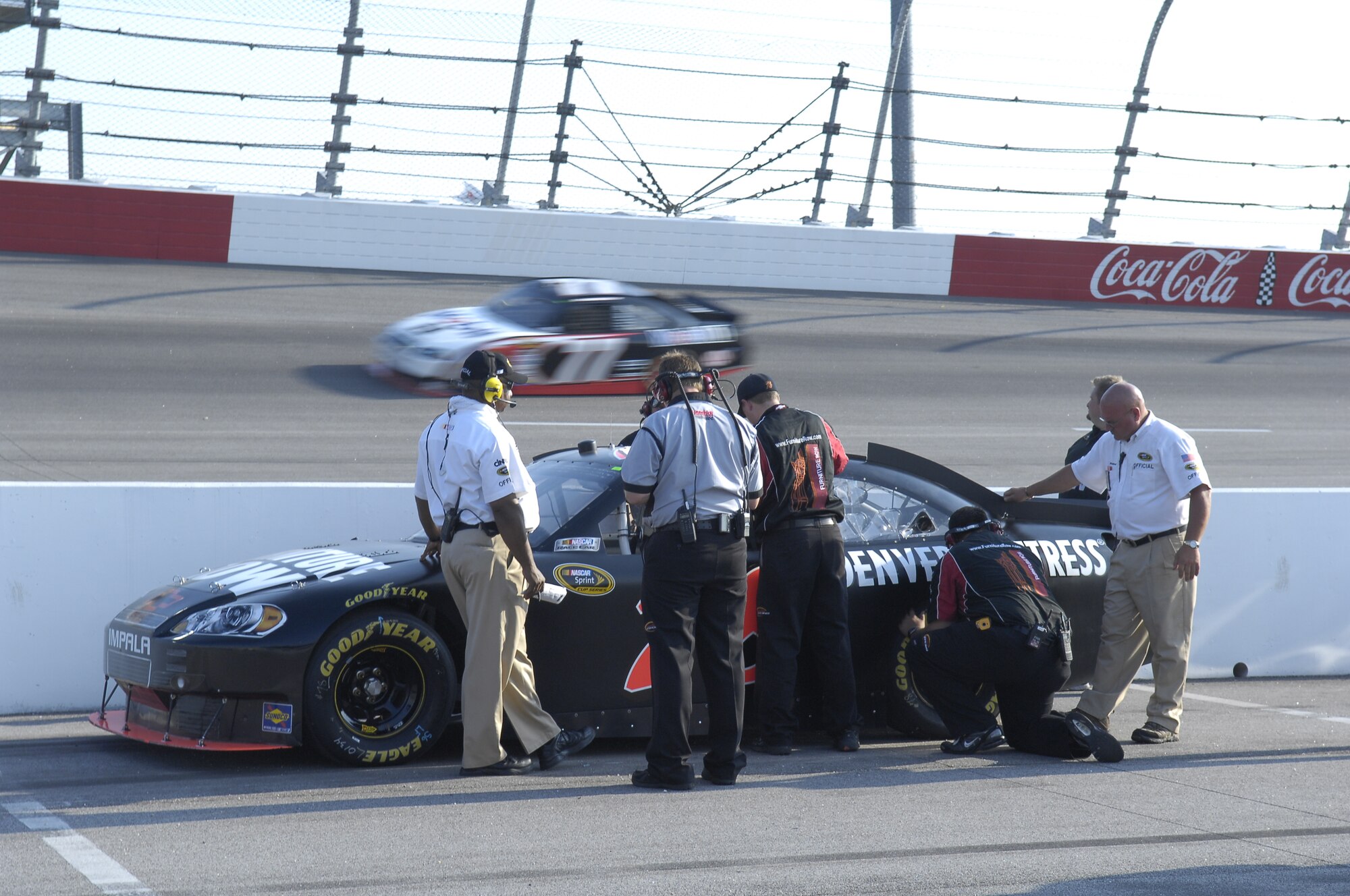 Cars begin to warm up before the Nationwide series Royal Purple 200 NASCAR race Darlington Raceway in Darlington S.C. on May 7. Master Sgt. Tressie Anderson-Bolden, 14th Air Support Operations Squadron First Sergeant, participated in the race-day events by singing the National Anthem at the beginning of the race. (U.S. Air Force photo/Senior Airman Kris Levasseur)
