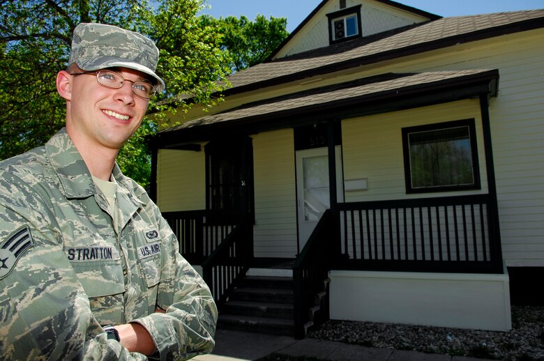MINOT, N.D. – Senior Airman Benjamin Stratton, 5th Bomb Wing public affairs, poses for a photo outside his newly purchased home here May 18. Becoming a home owner was an opportunity for Airman Stratton to accomplish his own American dream and have his very own Minot Adventure. (U.S. Air Force photo by Tech. Sgt. Thomas Dow)