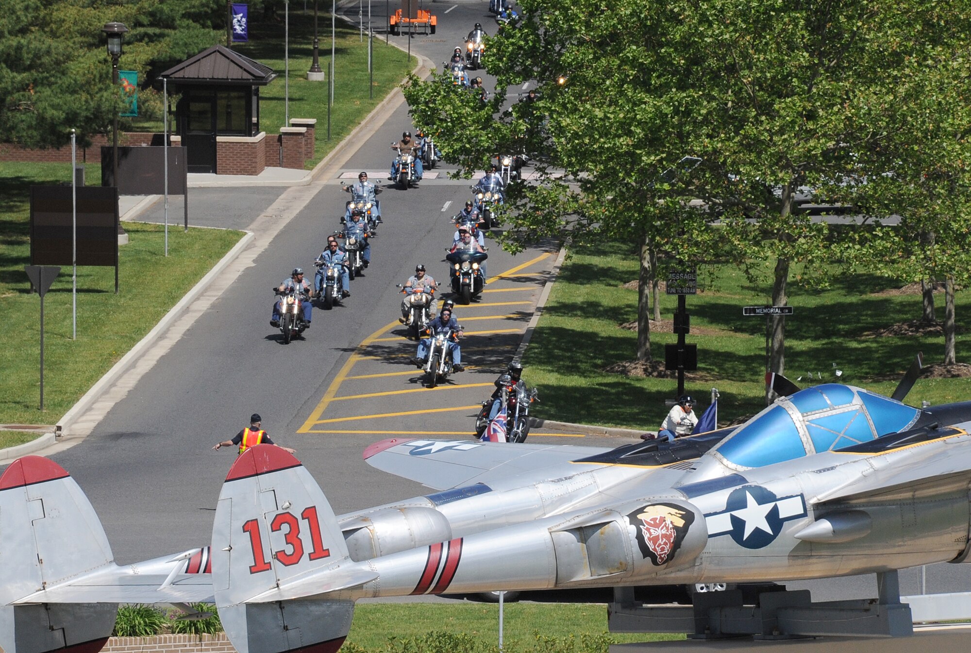 Motorcycle riders make their way through Pudgy Circle here during the Freedom Ride Sunday. More than 1,000 people participated in the annual event, which featured a ride along the McGuire flightline followed by food, live music and various vendors at Doughboy Field. (U.S. Air Force photo/Staff Sgt. Danielle Johnson)