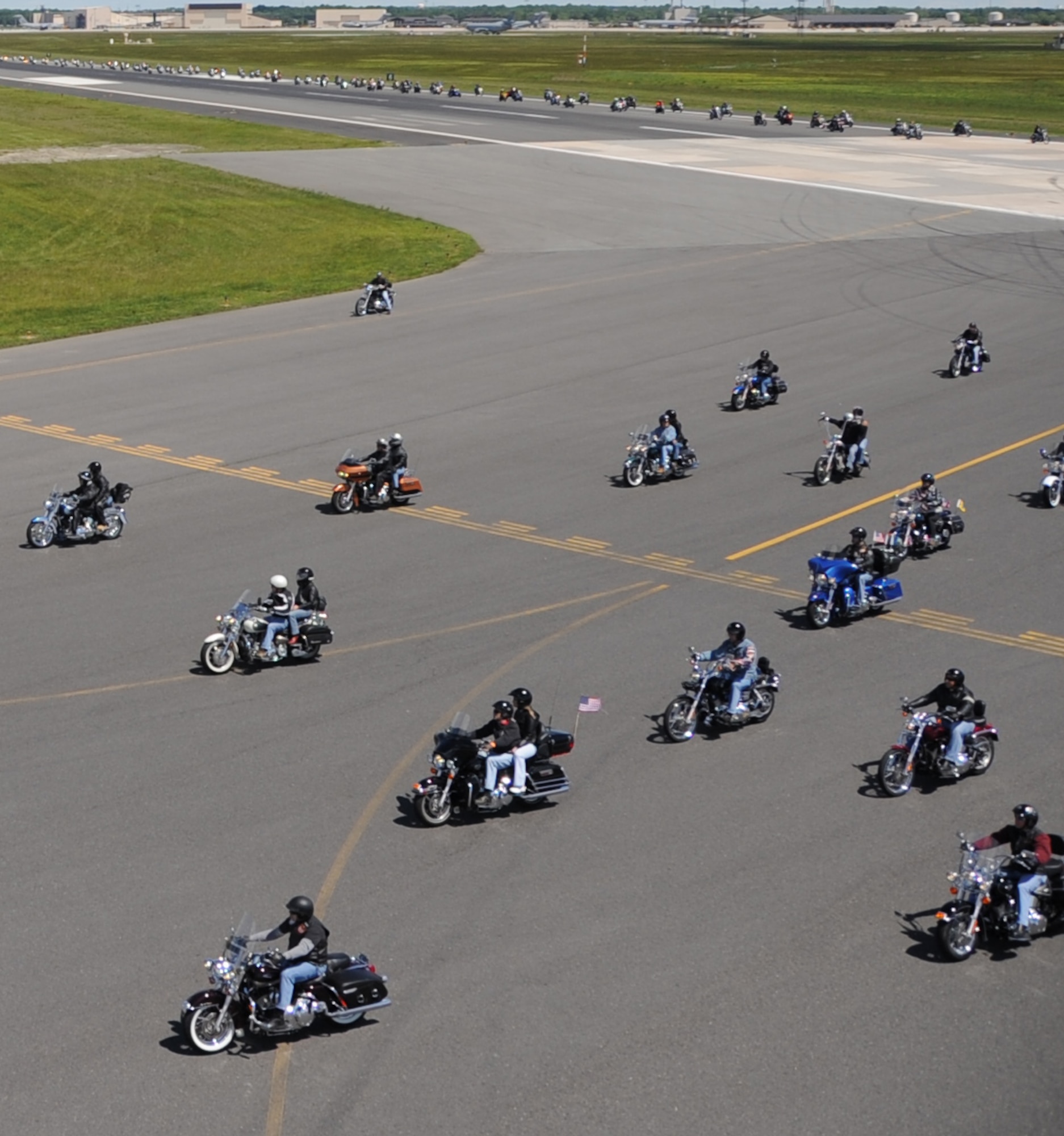 More than 1,000 motorcyclists make their way down the McGuire flightline during the annual Freedom Ride at here Sunday The event, which is organized by the Burlington County Military Affairs Committee also featured live music, food and vendors at the end of the ride. (U.S. Air Force photo/2nd Lt. Carolyn Glover)