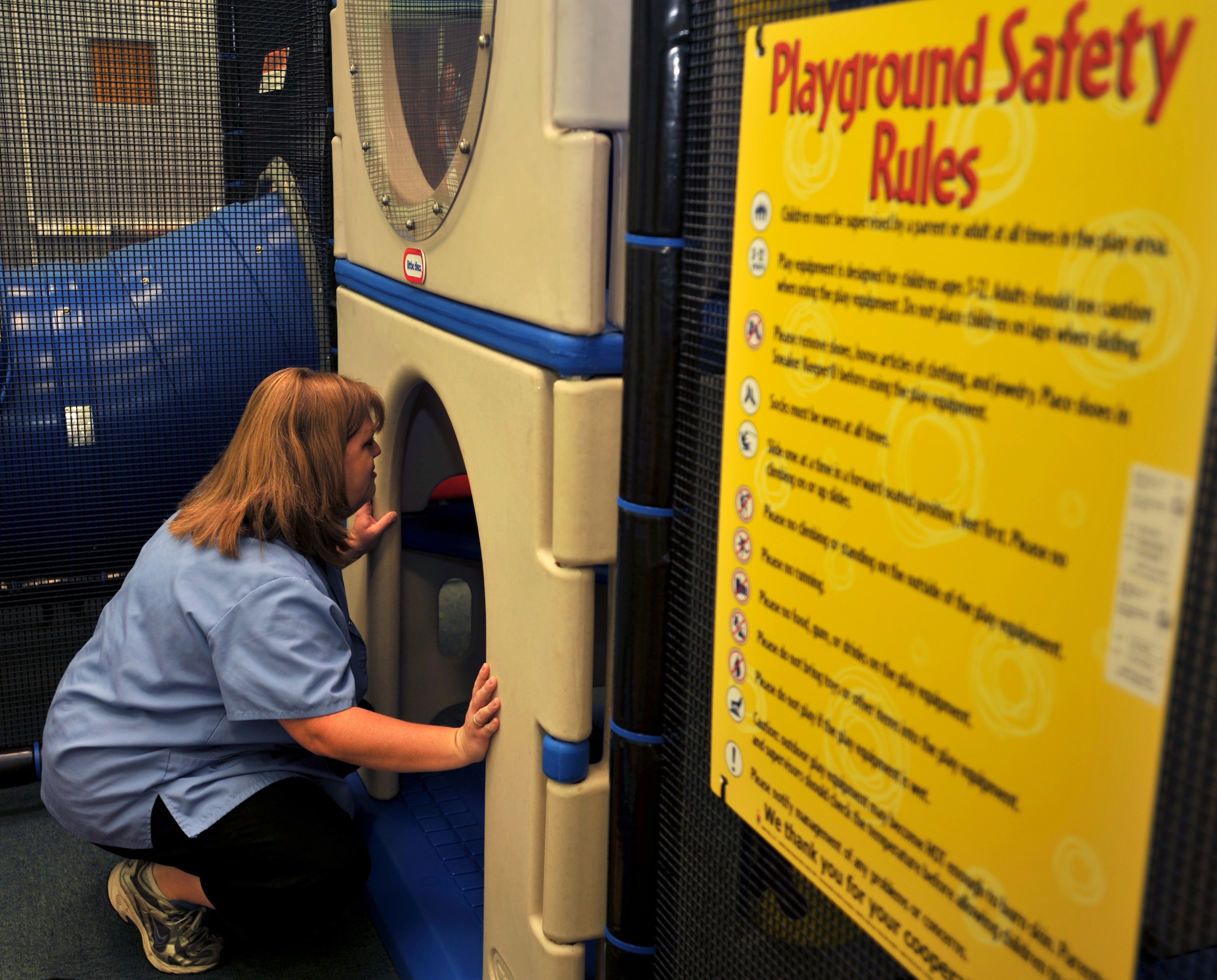 100518-F-4406D-003 SHAW AIR FORCE BASE, S.C. - Kathy Combs watches over a child in the parent child area at the Shaw Air Force Base fitness center May 18, 2010. The new parent child area allows parents the chance to receive supervised, free childcare for up to two hours while they work out. (U.S. Air Force photo/Airman 1st Class Tabatha L. Duarte)