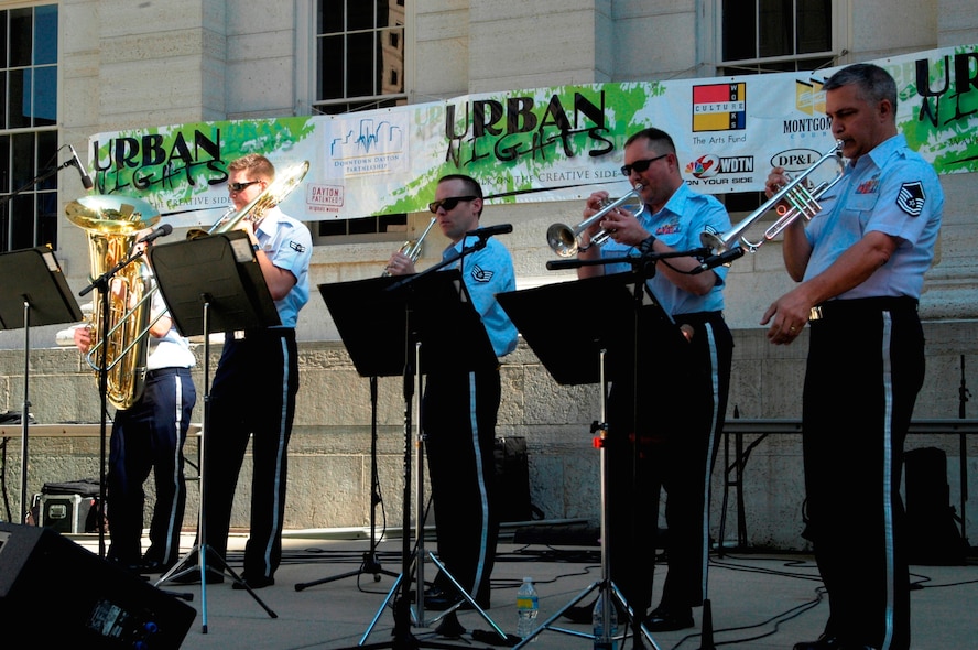 The five piece brass section of the New Harmony band from Wright-Patterson AFB, Ohio, played a popular tune “Brick House” by the Commodores at Dayton’s Urban Nights on May 14 in Downtown Dayton. (U.S. Air Force Photo by Ted Theopolos)