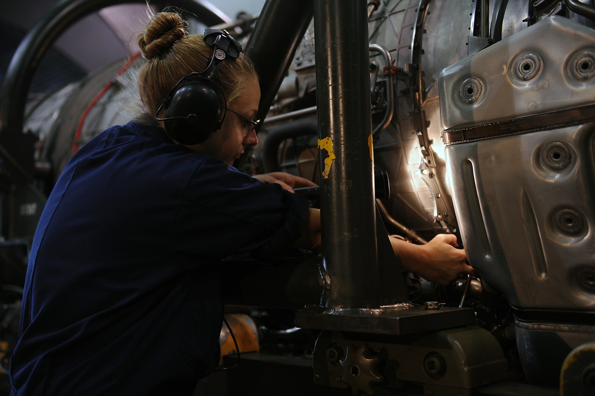 SEYMOUR JOHNSON AIR FORCE BASE, N.C. -- Staff Sgt. Ashley Guillory performs a final leak inspection after burner manifolds at the hush house May 13, 2010. A hush house is an aircraft power plant testing facility used to reduce the noise associated with running engines. Sergeant Guillory, 4th Component Maintenance Squadron aerospace propulsion craftsman, hails from Decatur, Ill. (U.S. Air Force photo/Senior Airman Ciara Wymbs)
