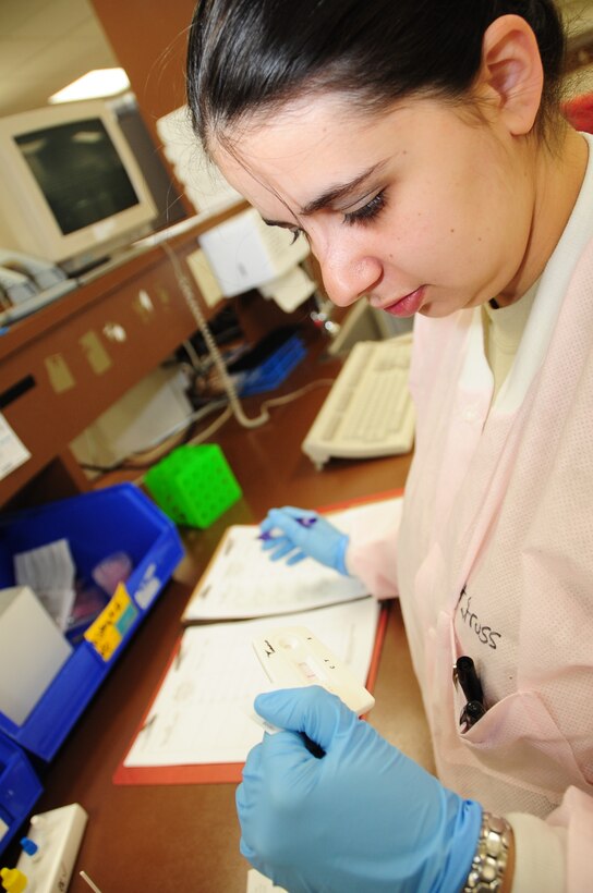 ELLSWORTH AIR FORCE BASE, S.D. -- Staff Sgt. Danielle Struss, 28th Medical Group lab technician, tests a patient’s throat swab for strep throat, May 18.  Sergeant Struss examined several throat swabs all of which came back negative for strep throat. (U.S. Air Force photo/Airman 1st Class Anthony Sanchelli)