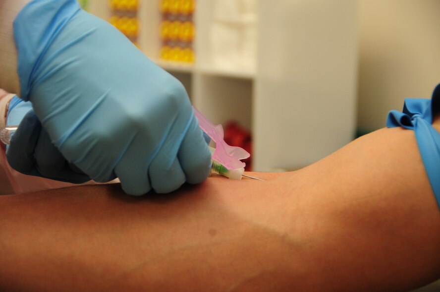 ELLSWORTH AIR FORCE BASE, S.D. -- Staff Sgt. Danielle Struss, 28th Medical Group lab technician, draws blood during a routine test, May 18.  Sergeant Struss will examine the blood for any impurities. (U.S. Air Force photo/Airman 1st Class Anthony Sanchelli)