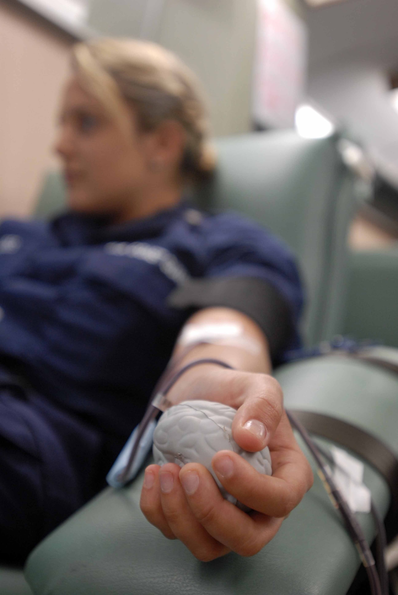U.S. Coast Guard Intelligence Specialist 3rd Class Vanessa Valdes, Navy Analyst and Reporting Course student, donates one pint of blood during a United Blood Service blood drive in the Commissary parking lot May 14. UBS technicians collect blood for distribution to more than 10 local area hospitals and are in constant need of O Negative blood type, which are the universally accepted type given in an emergency. (U.S. Air Force photo/Senior Airman Tong Duong)
