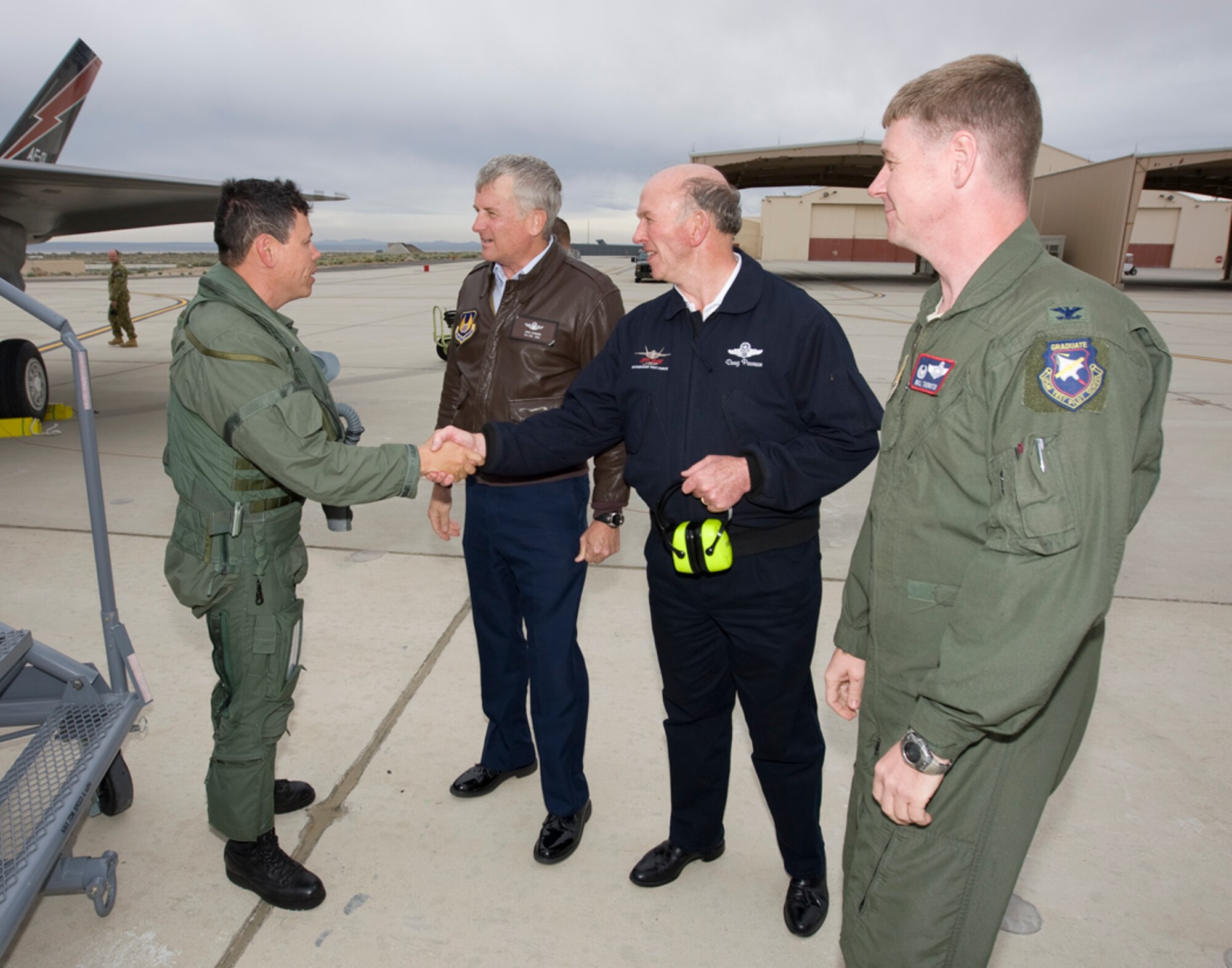 Left to right, Lt. Col Hank Griffiths, 461st Flight Test Squadron commander, and pilot of AF-01 during its flight from Ft. Worth, Texas to Edwards Air Force Base, Calif., is greeted by Maj.Gen David Eicchorn, Air Force Flight Test Center commander, retired Air Force Maj.Gen. Doug Pearson and Col. William Thornton, 412th Test Wing commander on his arrival at Edwards May 17.  AF-01 and AF-02, F-35 Lighting II Joint Strike Fighters, will call Edwards their new home.  (Official U.S. Air Force photograph)