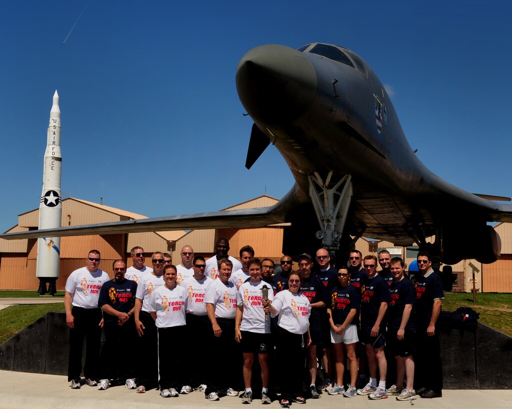 ELLSWORTH AIR FORCE BASE, S.D. -- Members of the Air Force Office of Special Investigations, Detachment 226 and South Dakota law enforcement pose for a photo in front of a B-1B Lancer with athletes from the South Dakota Special Olympics, May 17. The photo was taken prior to the group performing the Law Enforcement Torch Run, which kicks-off the Special Olympics. (U.S. Air Force photo/Airman 1st Class Joshua J. Seybert)