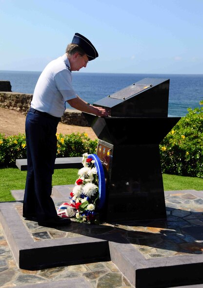 AGANA, GUAM – Lt. Gen. Frank G. Klotz, Air Force Global Strike Command commander, places his “commander’s coin” on the memorial to Raider 21, after laying a wreath at the site commemorating the B-52 crew that was lost when their B-52 went down in the Pacific  on Guam’s Liberation Day on July  21,  2008.  General Klotz visited the memorial during a trip to Guam and Andersen Air Force Base where he got a firsthand look at the continuous bomber presence mission.  (U.S. Air Force photo by Airman 1st Class Jeffrey Schultze)