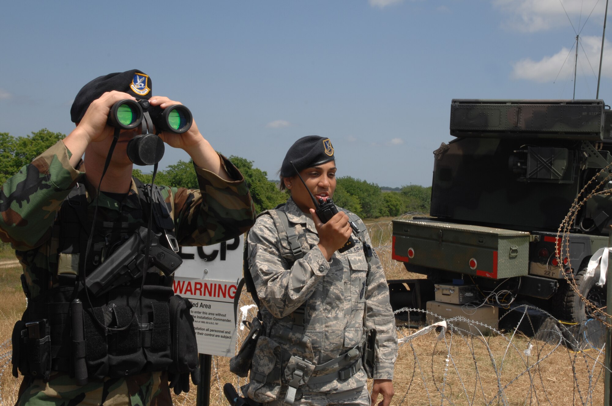 Savannah, GA--Staff Sgt. Josh Hartzell and Senior Airman Vanessa Garcia from the 165th Security Forces Squadron provide perimeter security for the Avengers on an off-site location. The Avenger will play an instrumental part during 4-day Ardent Sentry exercise to demonstrate the air defense.(U.S. Air Force photo by Tech. Sgt. Anika Williams)