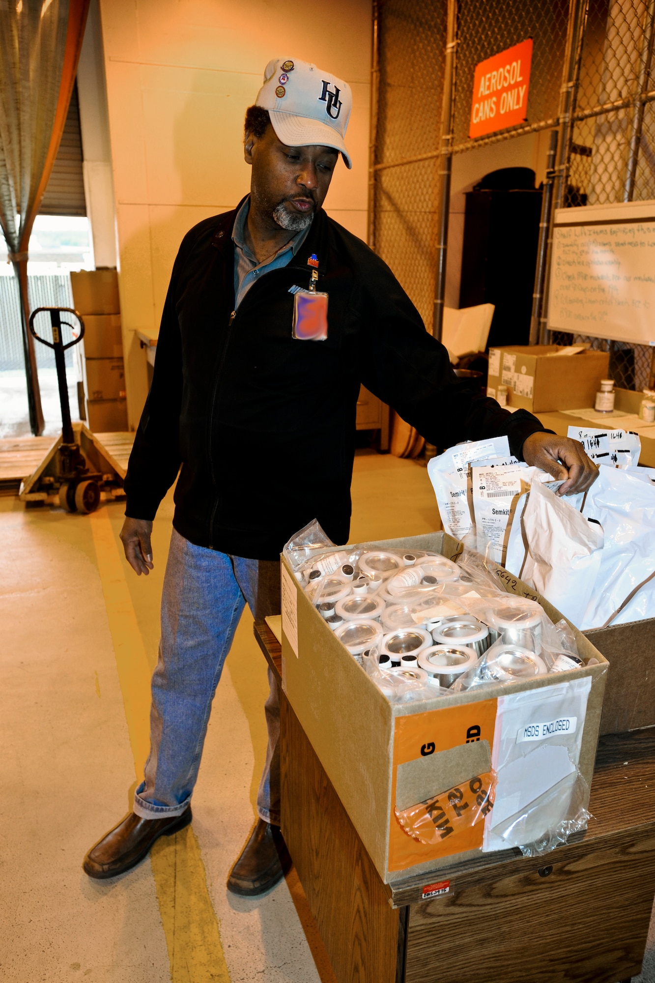 ELMENDORF AIR FORCE BASE, Alaska – Mr. Alfred McCarthy, 3rd Logistics Readiness Squadron Hazardous Material warehouse specialist, checks an incoming shipment of HAZMAT May 12. The warehouse holds all hazardous material at Elmendorf. (Air Force photo by Airman 1st Class Jack Sanders)