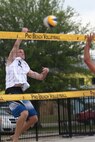 Tech. Sgt. Patrick McCarthy, 940th Logistics Readiness Squadron member, dominates the net, leading the Air Force team to a silver medal finish during competition at the Men's Beach Volleyball tournament at Marine Corps Air Station Cherry Point, May 3-12, McCarthy, a member of the first-ever Air Force Men's Beach Volleyball team, has been selected to the Armed Forces Volleyball squad. The multi-service all-star team is currently training at MCAS Cherry Point to represent the US military in international competition later this month. (U.S. Marine Corps Photo/Lance Cpl. Cory Polom)   