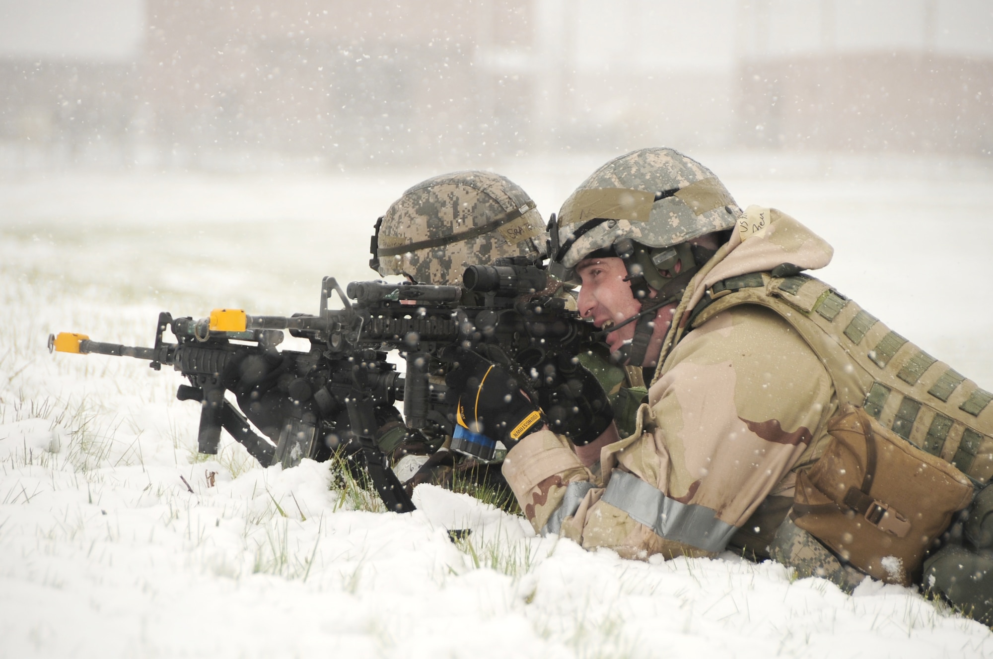 Senior Airman Kristi Terwilliger and Staff Sgt. Benjamin Pieta take aim during an operational readiness exercise May 12, 2010, at Ellsworth Air Force Base, S.D.  The Airmen are patrolmen with the 28th Security Forces Squadron.  (U.S. Air Force photo/Airman 1st Class Anthony Sanchelli)