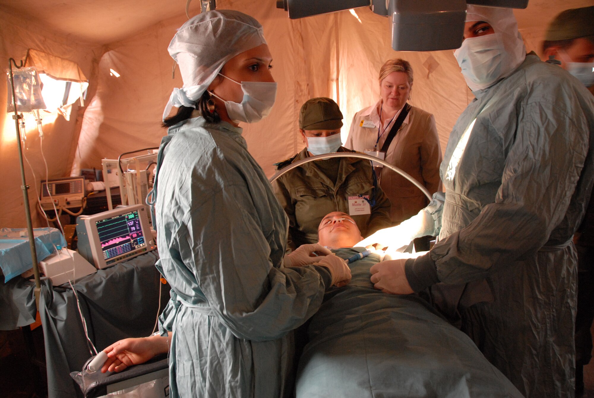 Wyoming state Rep. Lori Millin, back center, watches Tunisian medical technicians demonstrate capabilities during the MEDLITE-10 exercise in Tunisia.  Service members from several states visited the north-African country while participating in the MEDLITE-10 exercise at Kharrouba Air Base, Bizerte, Tunisia.  (USAF Photo by Master Sgt. Paul Mann/Released)
  