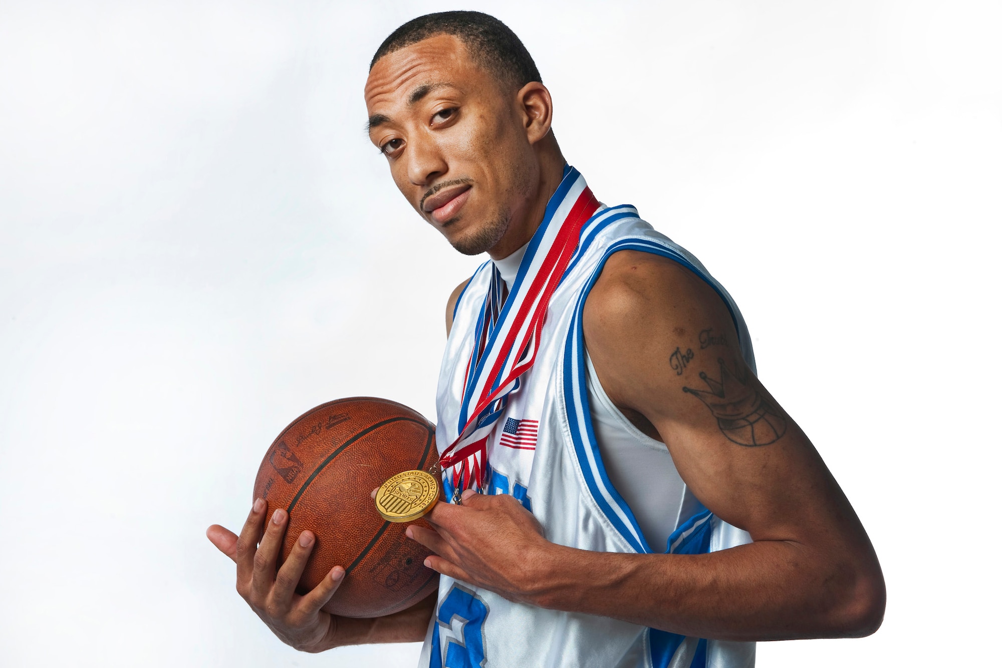 NELLIS AIR FORCE BASE, Nev. -- Staff Sgt. Marico Gray a 4 time All-Air Force, All-Armed Forces basketball team member from the 99th Contracting Squadron shows-off one of his four gold medals he earned as part of the All-Armed Forces basketball team. (U.S. Air Force photo by Tech. Sgt. Michael R. Holzworth)
