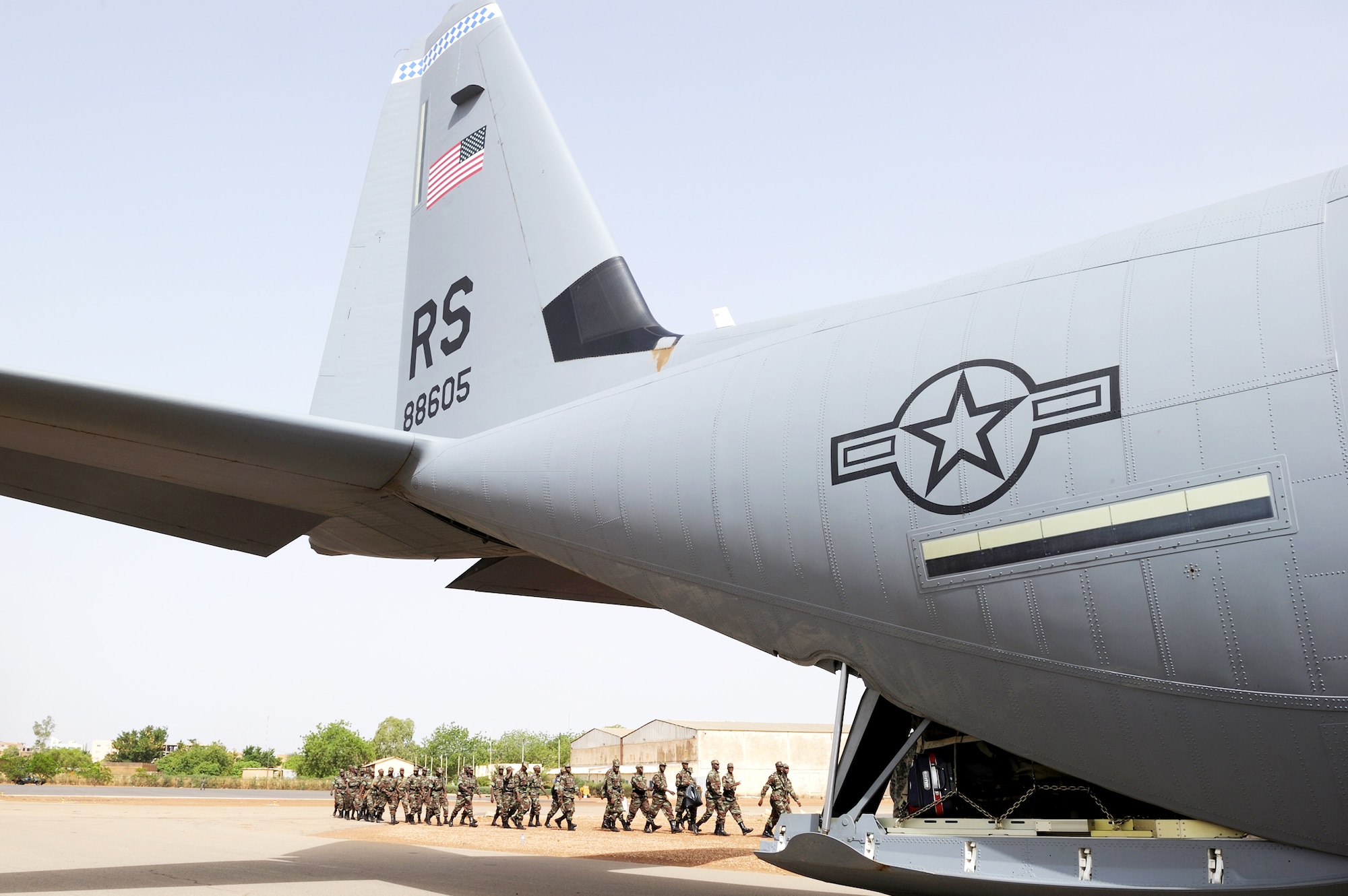 Burkinabe army soldiers march toward a C-130J Super Hercules to begin their deployment to Mali in support of Exercise Flintlock 10 May 1, 2010, in Ouagadougou, Burkina Faso. The C-130J is deployed from Ramstein Air Base, Germany.(U.S. Air Force photo/Master Sgt. Jeremiah Erickson)