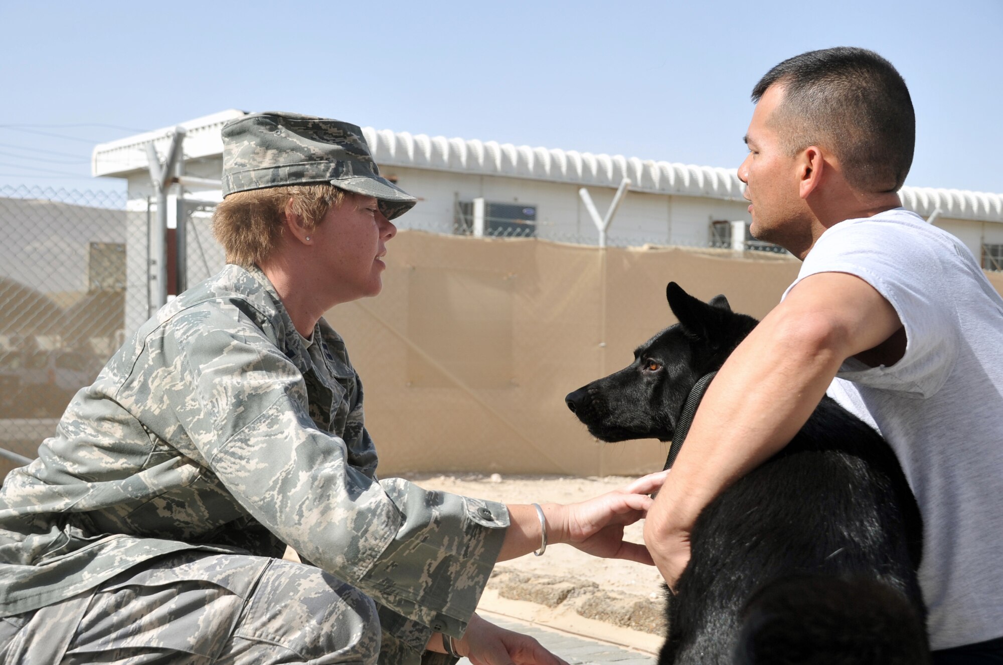 Capt. Nancy Lester, public health officer and licensed veterinarian with the 380th Expeditionary Medical Group, does a check-up with military working dog Nero at the 380th Expeditionary Security Forces Squadron operations area April 20, 2010, at a non-disclosed base in Southwest Asia. Captain Lester is deployed from the 86th Medical Group at Ramstein Air Base, Germany, and her hometown is Saint Francis, Wisc. (U.S. Air Force Photo/Master Sgt. Scott T. Sturkol/Released)