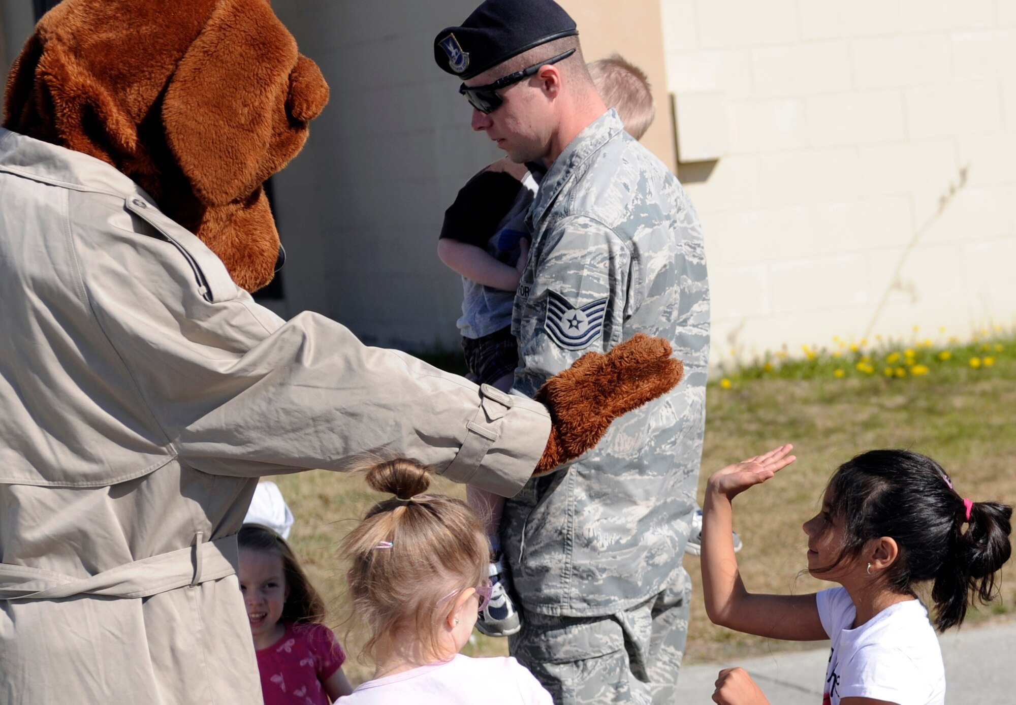 McGruff the crime dog meets with children May 14, 2010, Eielson Air Force Base, Alaska. McGruff was present for Police Appreciation and Safety Awareness Day a joint safety day where various base units set up stations for children to learn about safe practices and those who uphold their daily safety.(U.S. Air Force photo/Airman 1st Class Willard E. Grande II)