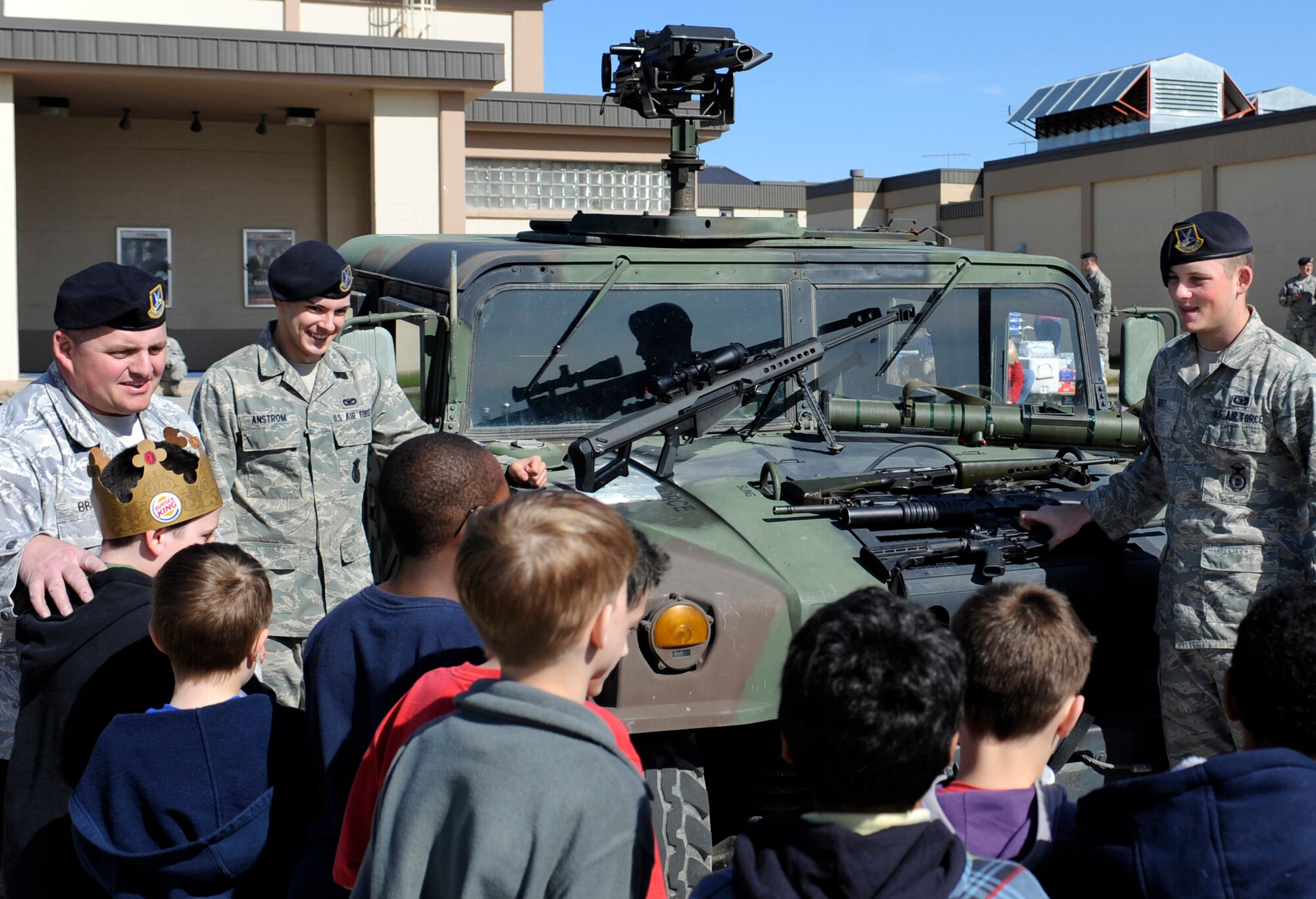 Airman Basic Zachary Bert educates a group of children on various weapons, past and present May 14, 2010, Eielson Air Force Base, Alaska. The weapons display was a part of the 2nd annual joint Police Appreciation and Safety Awareness Day. Airman Bert is assigned to the 354th Security Forces Squadron. (U.S. Air Force photo/Airman 1st Class Willard E. Grande II)