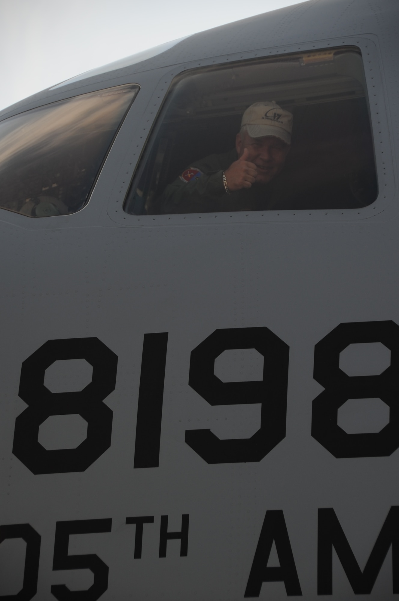 Col. James Weber, 305th Maintenance Group commander, gives a thumbs up from the cockpit of JB MDL's newest C-17 Globemaster. Weber took the final flight of his Air Force career during the aircraft's inaugural flight. Three new Globemasters were assigned here as a result of a congressionally-approved increase in the aircraft throughout Air Mobility Command. (U.S. Air Force photo/2nd Lt. Carolyn Glover)