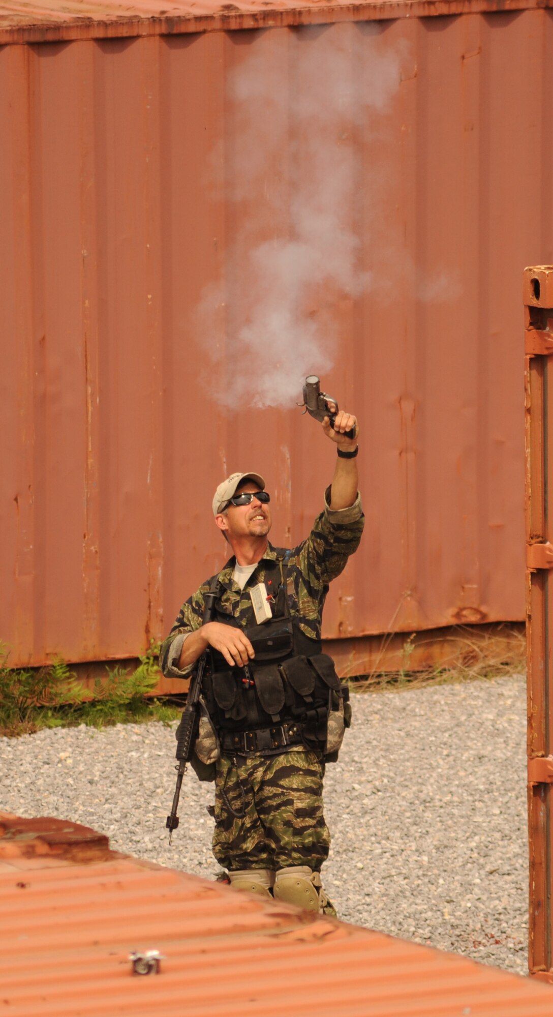 Charles Stewart, 1st Special Operations Support Squadron Range Support flight opposition forces member, fires a flare into the air during combat survival training at an undisclosed location in the Eglin Range, Fla., May 13, 2010. OPFOR provides support capabilities to 1st Special Operations Wing aircraft and ground assets, and, when available, other Air Force Special Operations Command, Air Force and joint partners who request them.  (DoD photo by U.S. Air Force Senior Airman Matthew Loken)