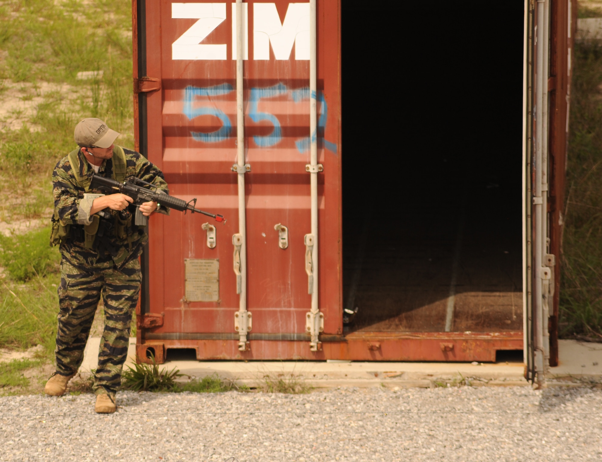 Mathew Comeau, 1st Special Operations Support Squadron Range Support flight opposition forces member, scans for Survival, Evasion, Resistance and Escape students during combat survival training at an undisclosed location in the Eglin Range, Fla., May 13, 2010. OPFOR provides support capabilities to 1st Special Operations Wing aircraft and ground assets, and, when available, other Air Force Special Operations Command, Air Force and joint partners who request them.  (DoD photo by U.S. Air Force Senior Airman Matthew Loken)
