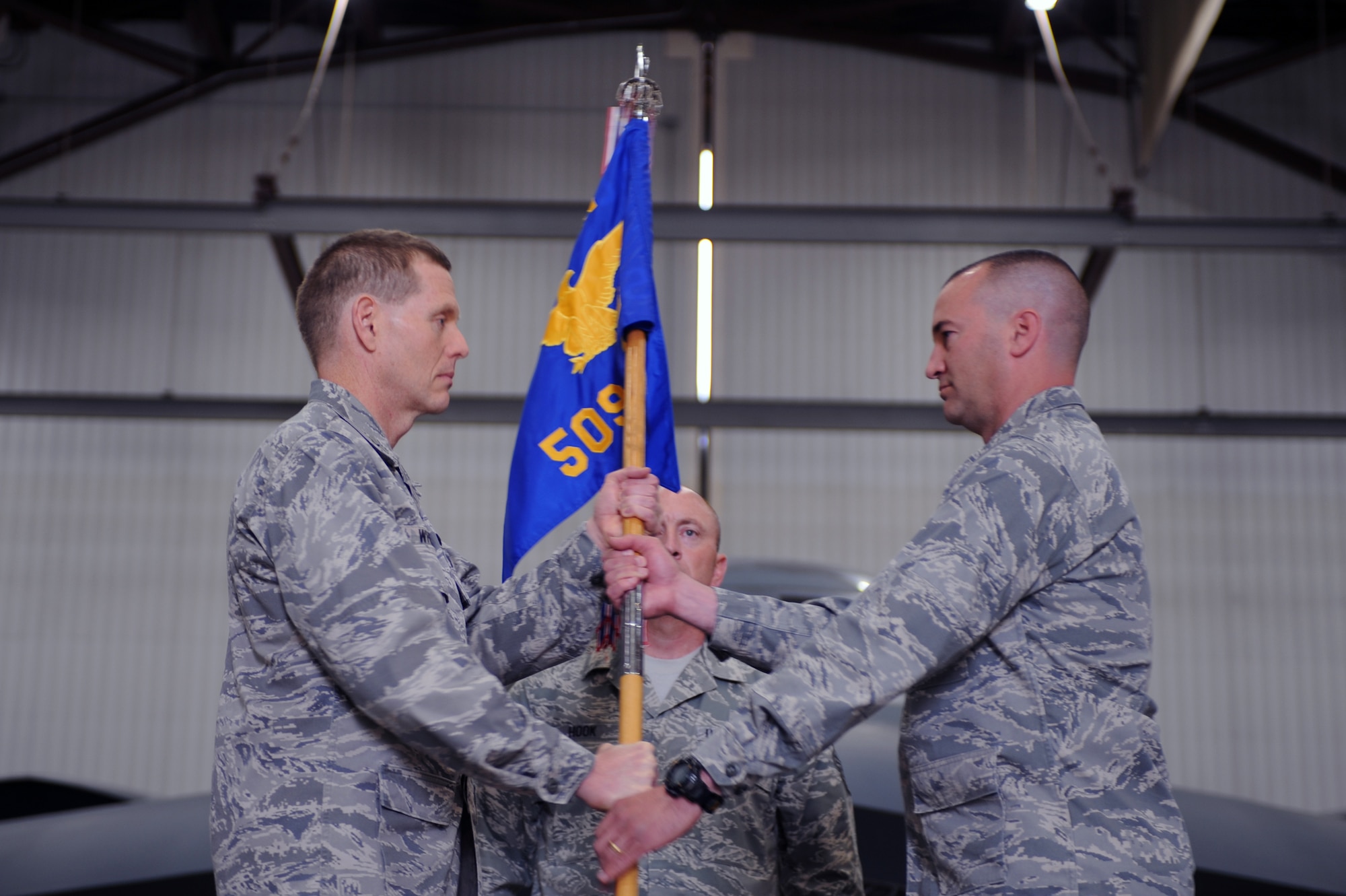 WHITEMAN AIR FORCE BASE, Mo., -- Col. Matthew Kmon receives the guidon from Brig. Gen. Robert Wheeler, 509th Bomb Wing commander, assuming command of the 509th Maintenance Group during a ceremony here May 14, 2010. (U.S. Air Force photo/Staff Sgt. Jason Huddleston) (Released)