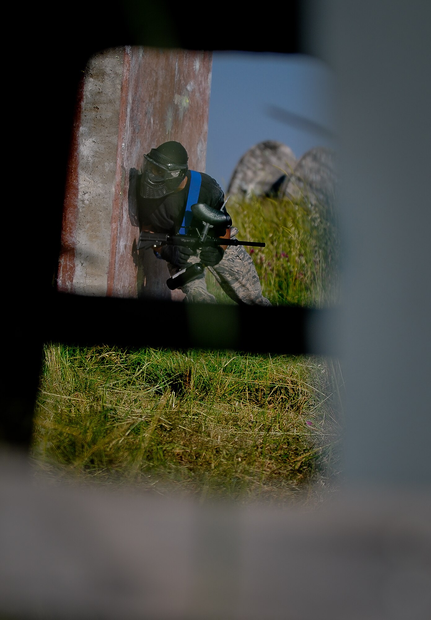 An Airman from the 39th Security Forces Squadron hides behind a wall during a Police Week paintball tournament, Thursday May 13, 2010 at Incirlik Air Base, Turkey. (U.S. Air Force photo/Senior Airman Sara Csurilla)