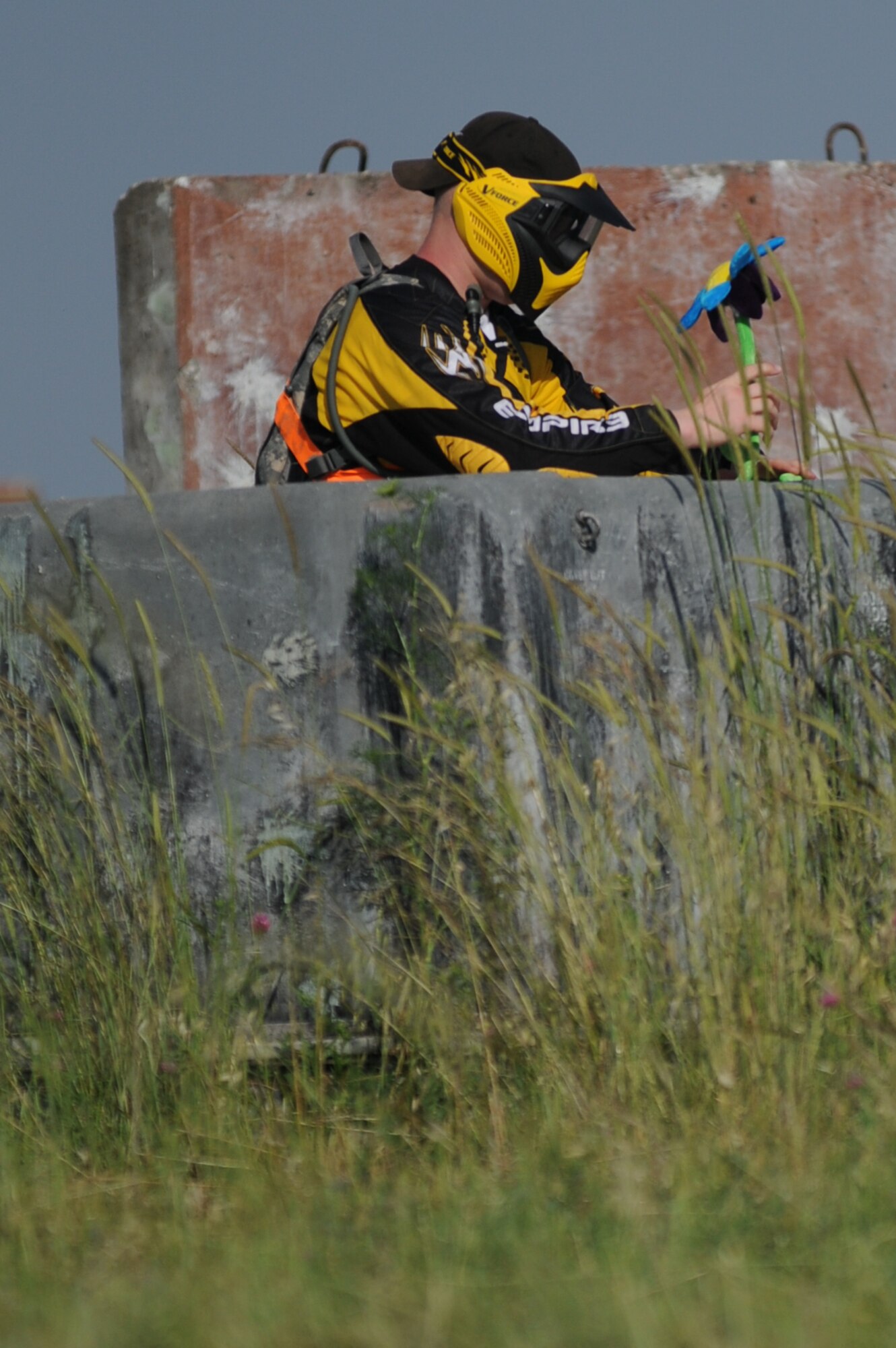 An Airman from the 39th Security Forces Squadron places a fake flower in the middle of a paintball field to act as the trophy before the beginning of a Police Week paintball tournament, Thursday May 13, 2010 at Incirlik Air Base, Turkey. (U.S. Air Force photo/Senior Airman Sara Csurilla)