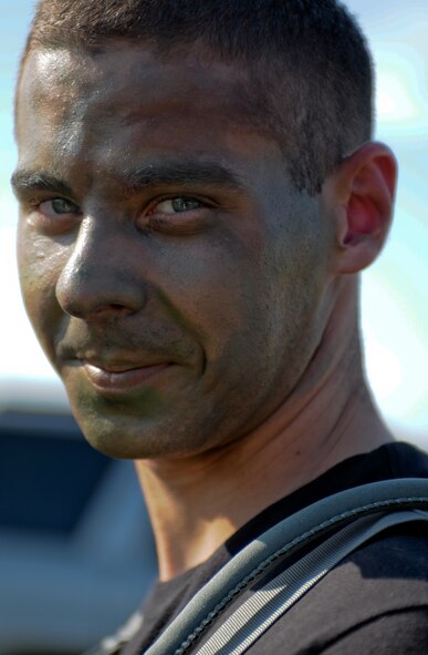 An Airman from the 39th Security Forces Squadron is ready for “paintball war” with a painted face for a Police Week paintball tournament, Thursday May 13, 2010 at Incirlik Air Base, Turkey. (U.S. Air Force photo/Senior Airman Sara Csurilla)