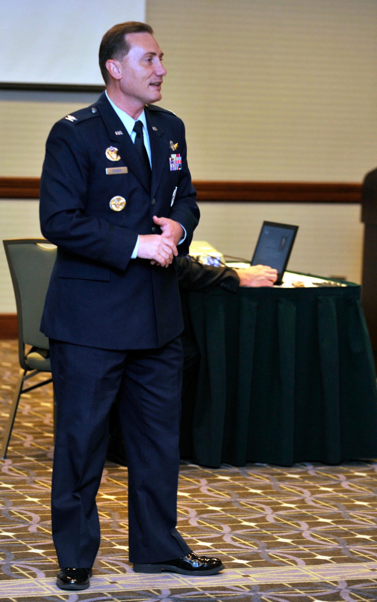 BUCKLEY AIR FORCE BASE, Colo. -- Col. Clint Crosier, 460th Space Wing commander, gives a mission briefing during the Native American Consultation May 12. Native American tribes from across many states came to visit with Buckley leaders. (U.S. Air Force photo by Airman 1st Class Paul Labbe)
