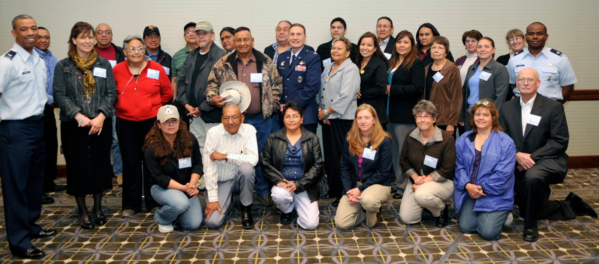 BUCKLEY AIR FORCE BASE, Colo. -- Members of several Native American tribes pose with Col. Clint Crosier, 460th Space Wing commander, Col. Vincent Jefferson, 460th Mission Support Group commander, and Lt.Col George Petty, 460th Civil Engineer Squadron commander. (U.S. Air Force photo by Airman 1st Class Paul Labbe)