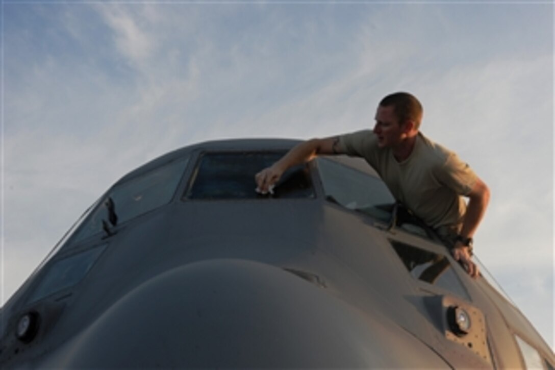 U.S. Air Force Staff Sgt. Justin Smith, a C-130 Hercules aircraft aerial spray maintainer with the 910th Aircraft Maintenance Squadron, Youngstown-Warren Air Reserve Station, Ohio, cleans an aircraft's windshield at Stennis International Airport, Miss., on May 10, 2010.  Members of the wing were in the state to assist with the Deepwater Horizon oil spill.  