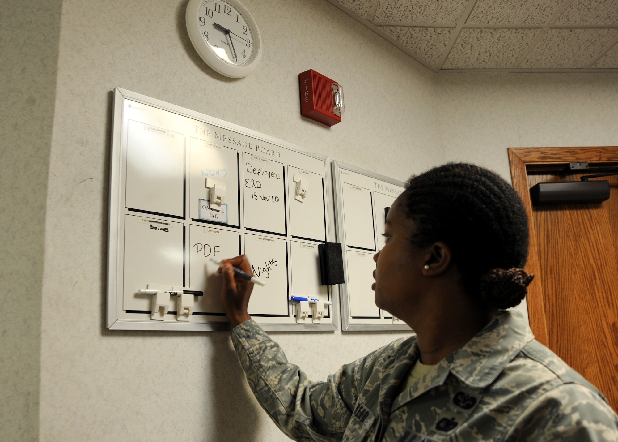 Tech. Sgt. LaShawn Reed, 22nd Air Refueling Wing base legal office assistant marks the status of personnel on shift at the base legal office May 19, 2010, McConnell Air Force Base, Kan.  The legal office divided its staff into shifts to conduct 24-hour operations during an operational readiness exercise May 18 to 20, to help Airmen with any legal issues or questions for short notice deployments or emergencies.  (U.S. Air Force photo/Airman 1st Class Andrea Salazar)