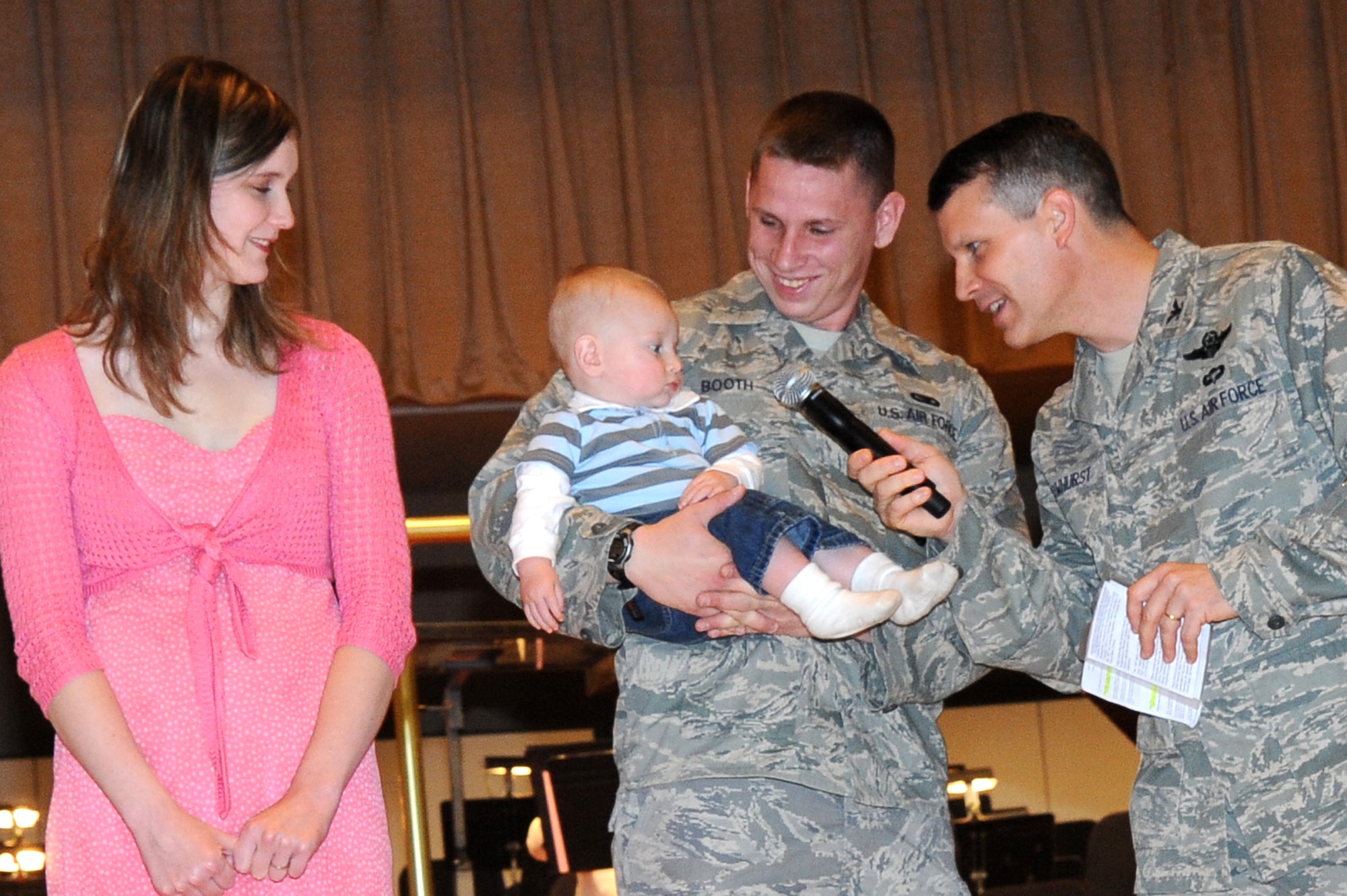Col. Jamie Crowhurst, 22nd Air Refueling Wing commander, asks for input from Ardon, 9 months old, about his feelings on his father’s recent deployment as his parents Senior Airman Stephen Booth, 22nd Security Forces Squadron vehicle control NCO, and Laura look on, May 15, 2010, at a River Festival military recognition ceremony held at Century II in downtown Wichita, Kan.  The Booth family was one of several families recognized in McConnell’s Year of the Air Force Family Recognition program.  The program was developed in conjunction with the Air Force’s designation of 2010 as the Year of the Air Force Family.  As a result, McConnell’s Airmen and Family Readiness Center developed a program to recognize McConnell’s outstanding military families.  McConnell’s AFRC provides support for more than 16,000 base personnel and dependents. (U.S. Air Force photo/Tech. Sgt. Chyrece Campbell)