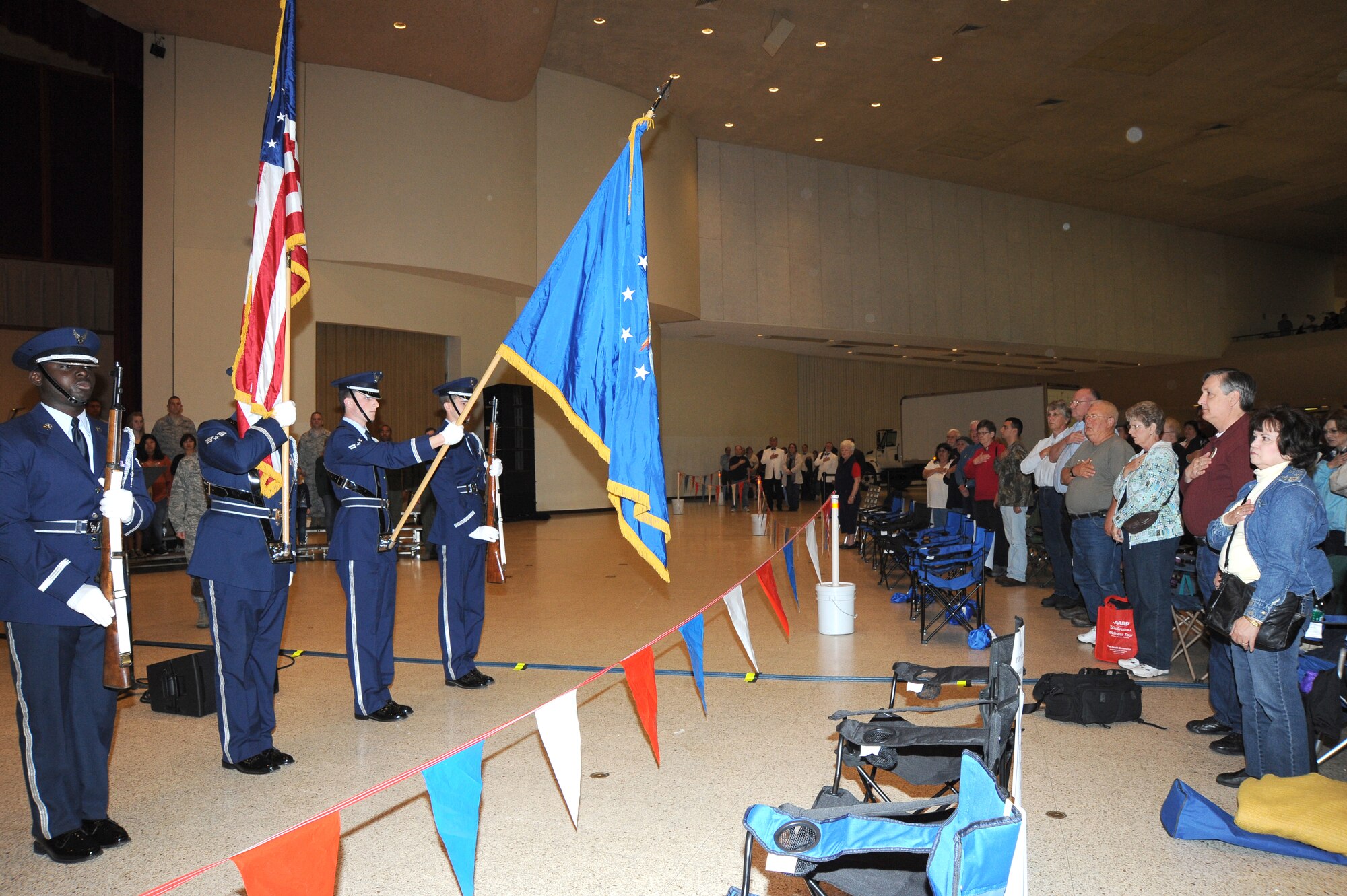 McConnell’s honor guard post the colors at a Wichita River Festival military recognition ceremony, May 15, 2010, held at Century II in downtown Wichita, Kan.  Col. Jamie Crowhurst, 22nd Air Refueling Wing commander, recognized six Team McConnell Airmen and families during the ceremony for their significant volunteer contributions to the community.  The families recognized represented the more than 5,610 Airmen stationed at McConnell.  In 2009, Team McConnell Airmen accumulated more than 30,470 volunteer hours. (U.S. Air Force photo/Tech. Sgt. Chyrece Campbell)