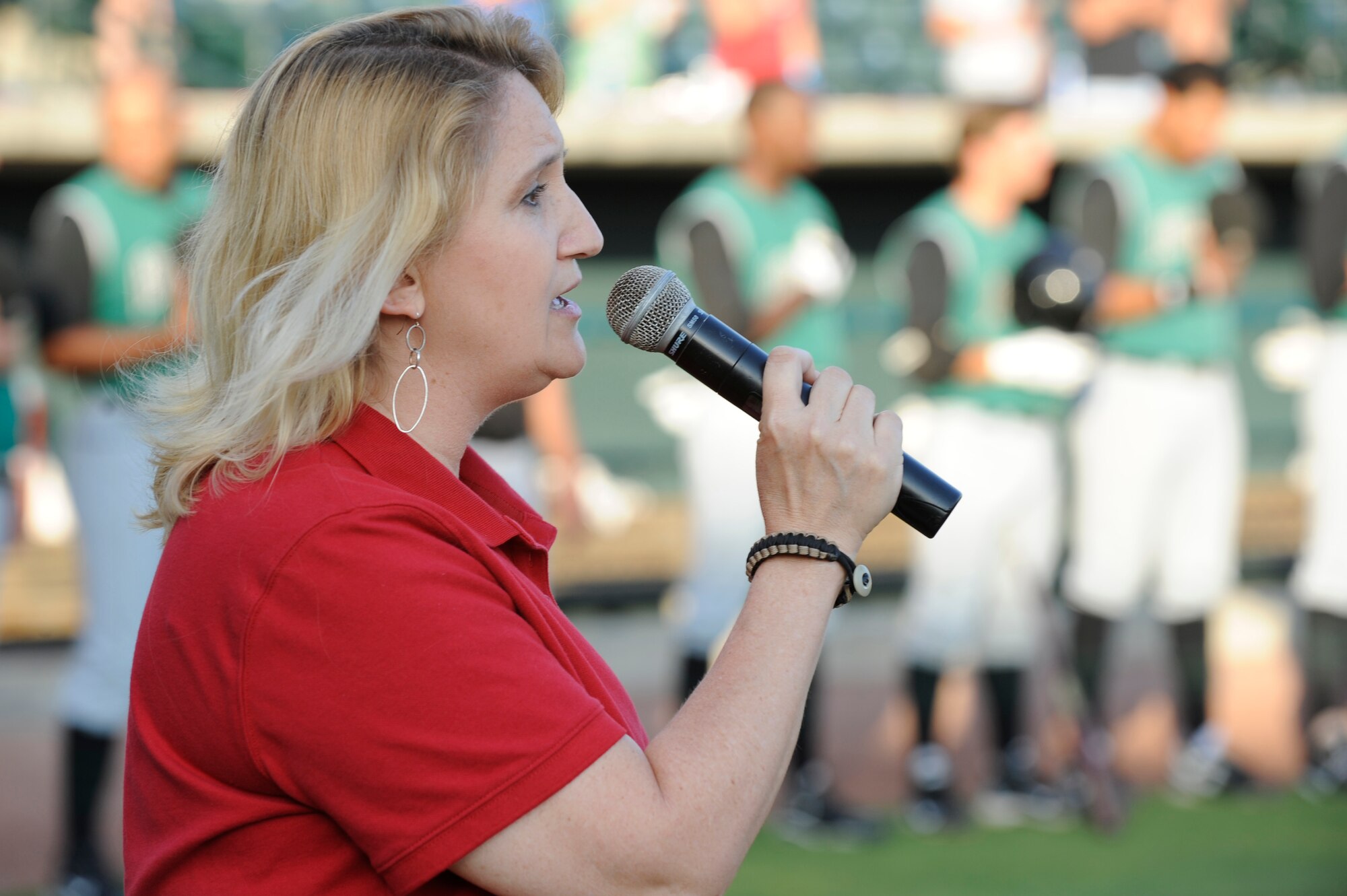 Cynthia Holt sings the National Anthem prior to the start of the Charleston RiverDogs baseball game held at Joseph P. Riley Jr., Park May 13, 2010. The RiverDogs are a Class-A affiliate of the San Francisco Giants and have celebrated more than ten years of baseball action in "The Joe." 
