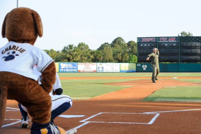 Col. Mike Speer winds up for the first pitch at the start of the Charleston RiverDogs baseball game at Joseph P. Riley Jr., Park May 13, 2010. Colonel Speer is retiring after a 26-year career with the Air Force, serving both as active duty and Reserve. The Charleston RiverDogs held a military appreciation night, which was free to all military and Department of Defense ID cardholders and their families. The Charleston RiverDogs beat the Augusta GreenJackets, 3-2. Colonel Speer is vice commander of the 315th Airlift Wing. See more pictures on Page 22.