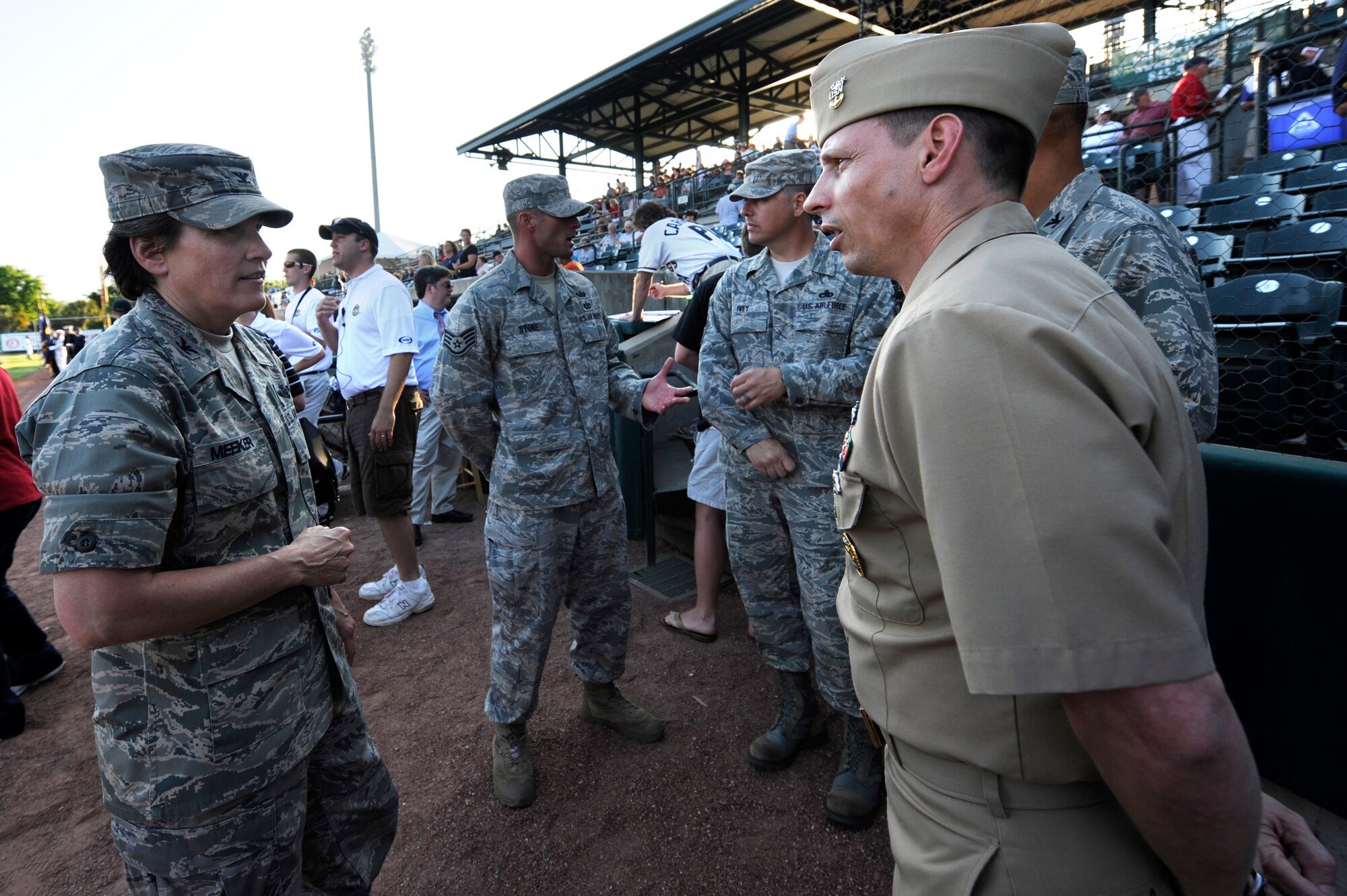 U.S. Air Force Col. Martha Meeker speaks with Navy Command Master Chief Petty Officer Bill Cady during the Charleston RiverDogs baseball game at Joseph P. Riley Jr., Park May 13, 2010. Colonel Meeker is the commander of Joint Base Charleston and Master Chief Cady is the Command Master Chief for Naval Weapons Station Charleston.


