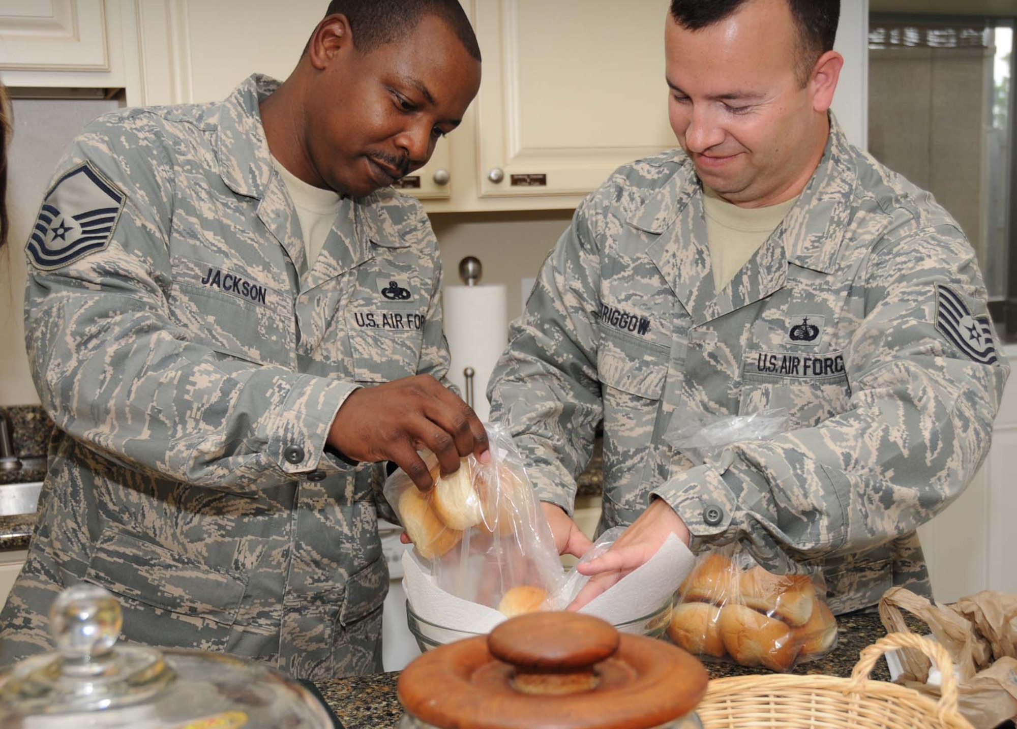 Sgt. Gregory Jackson, left, Mathies NCO Academy, and Tech. Sgt. Rich Striggow, 333rd Training Squadron, help with dinner preparations at Fisher House May 13.  The dinner was prepared by members of the Air Force Sergeants Association Chapter 652.  Keesler’s Fisher House provides a home-away-from-home for the families of patients seeking treatment at the 81st Medical Group Hospital or the Veterans Affairs Medical Center in Biloxi.  Keesler’s facility is one of 45 Fisher Houses located on 18 military installations and 15 VA medical centers.  (U.S. Air Force photo by Kemberly Groue)