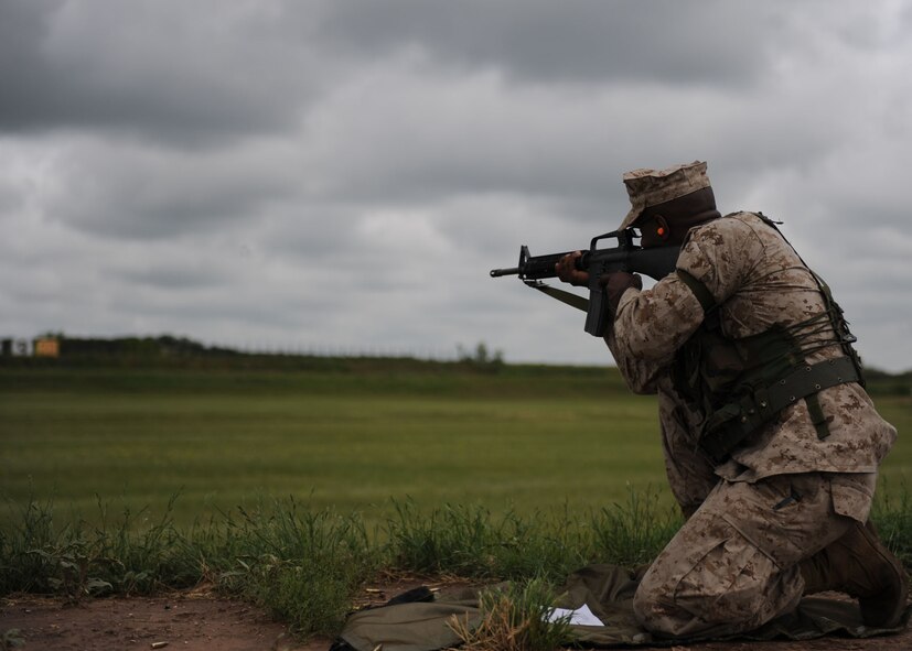 Fort Wolters,Texas— Corporal Joseph Fearn fires his rifle at a target May 15 to qualify during field training.  Dyess Marines are assigned to Detachment 1 in support of motor transport assets. They are required to qualify with the rifle annually by shooting from the 200, 300 and 500 yard marks from the sitting, kneeling, standing and prone positions. Weapons qualification is based on a points system earning them marksman, sharp shooter or expert title. (U.S. Air Force photo/ Airman 1st Class Brittney Smolinski)
