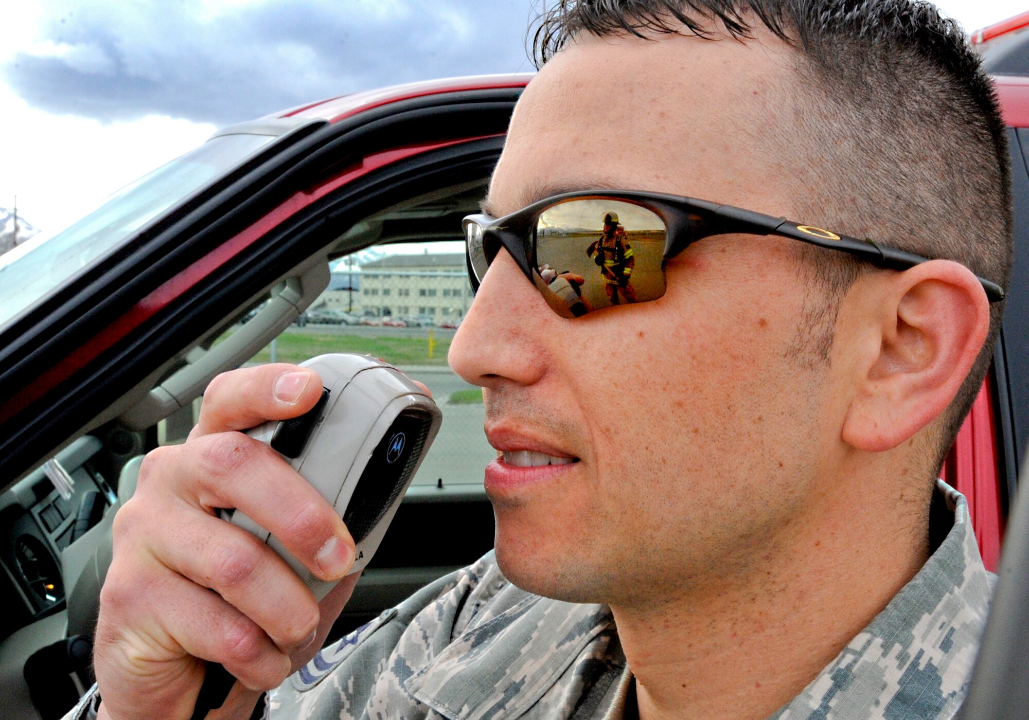 Tech. Sgt. Rikk Matteson gives instruction over the radio to fire protection team members during a daily training exercise May 13, 2010, at Elmendorf Air Force Base, Alaska.  Sergeant Matteson is the 3rd Civil Engineer Squadron A shift battalion chief. (U.S. Air Force photo/Airman 1st Class Jack Sanders)